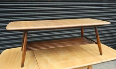 Vintage 1960s  Ercol elm coffee table with magazine shelf