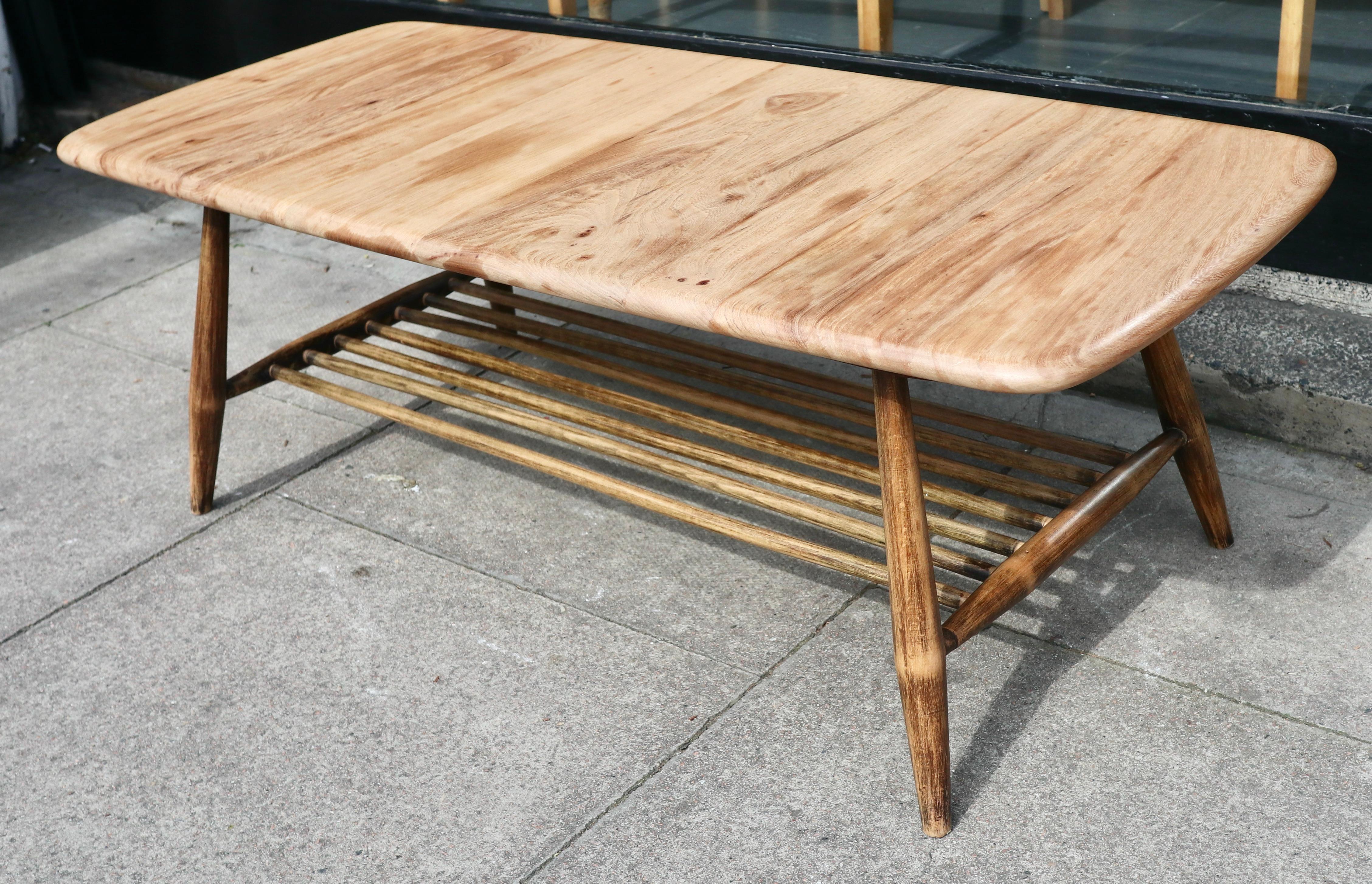 Elm Vintage 1960s  Ercol elm coffee table with magazine shelf   For Sale