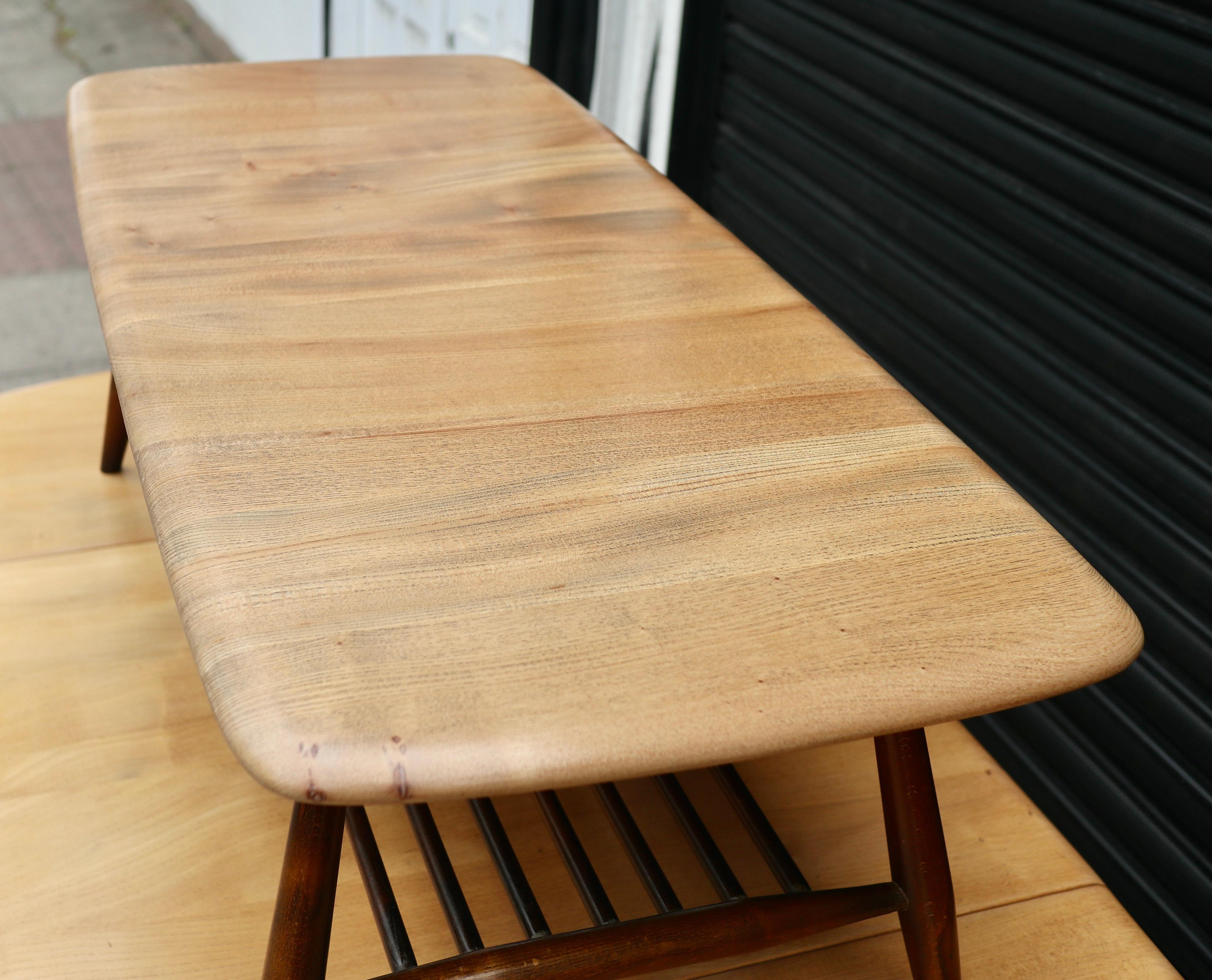 Elm Vintage 1960s  Ercol elm coffee table with magazine shelf   For Sale