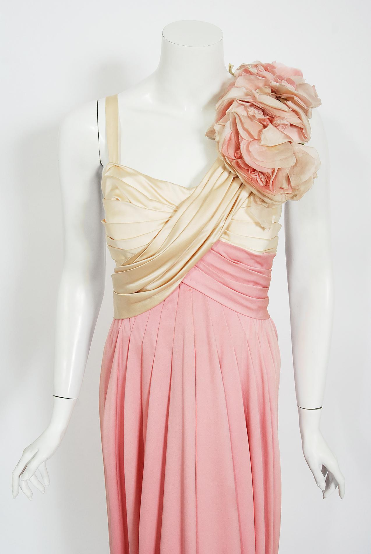 A breathtaking pale pink silk and ivory satin custom-made 20th Century Fox gown dating back to the early 1960's. Though I am unsure of which production this gorgeous gown is from, the detailed construction and meticulous attention to detail makes me