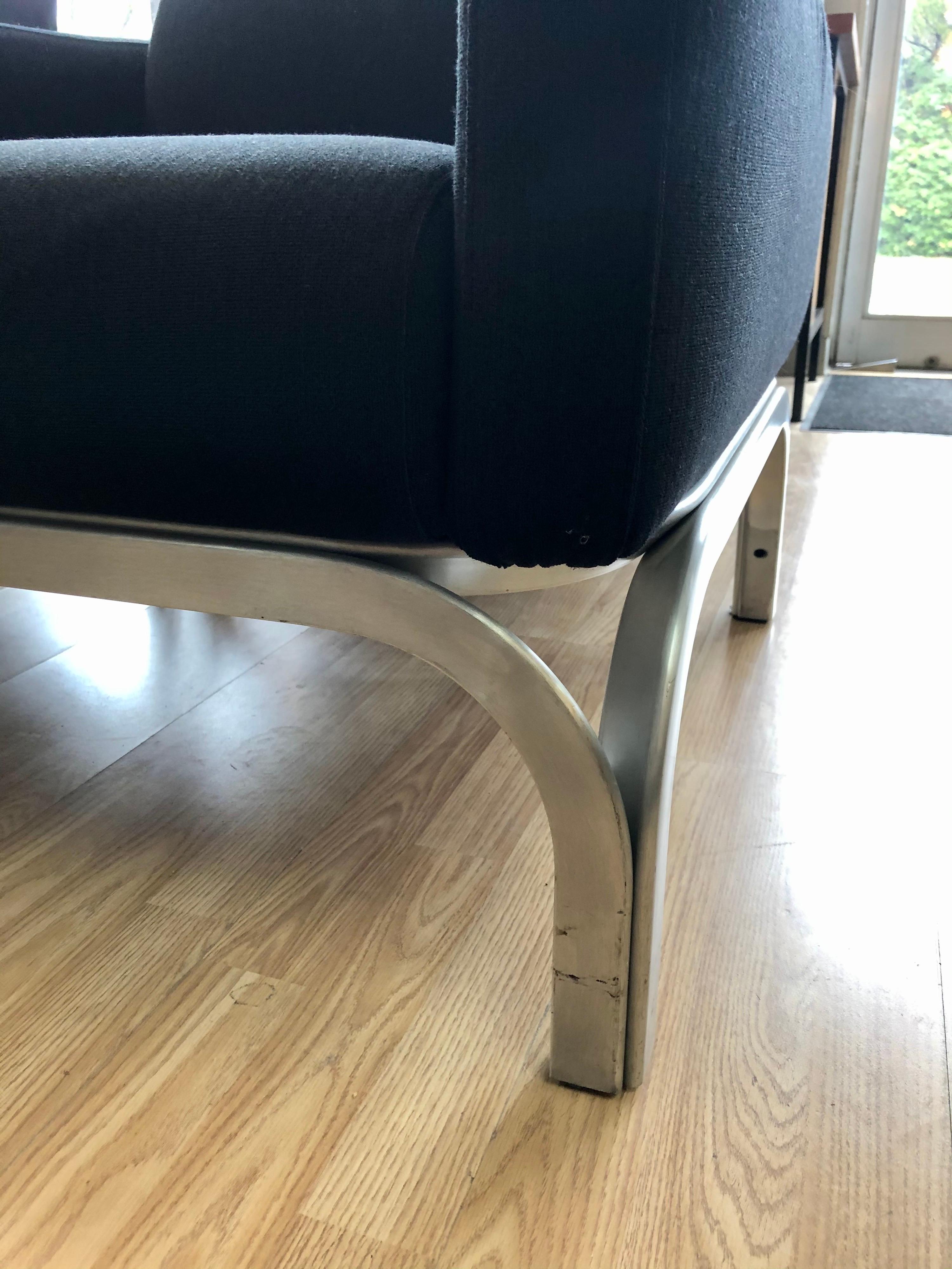 Designed by Fritz Hansen. Labeled. This pair is in overall good condition. Original black upholstery. Aluminum base.
1960s, Denmark.
Dimensions:
26.5” H x 28.5” D x 28” W
16” seat height
21.5” arm height.