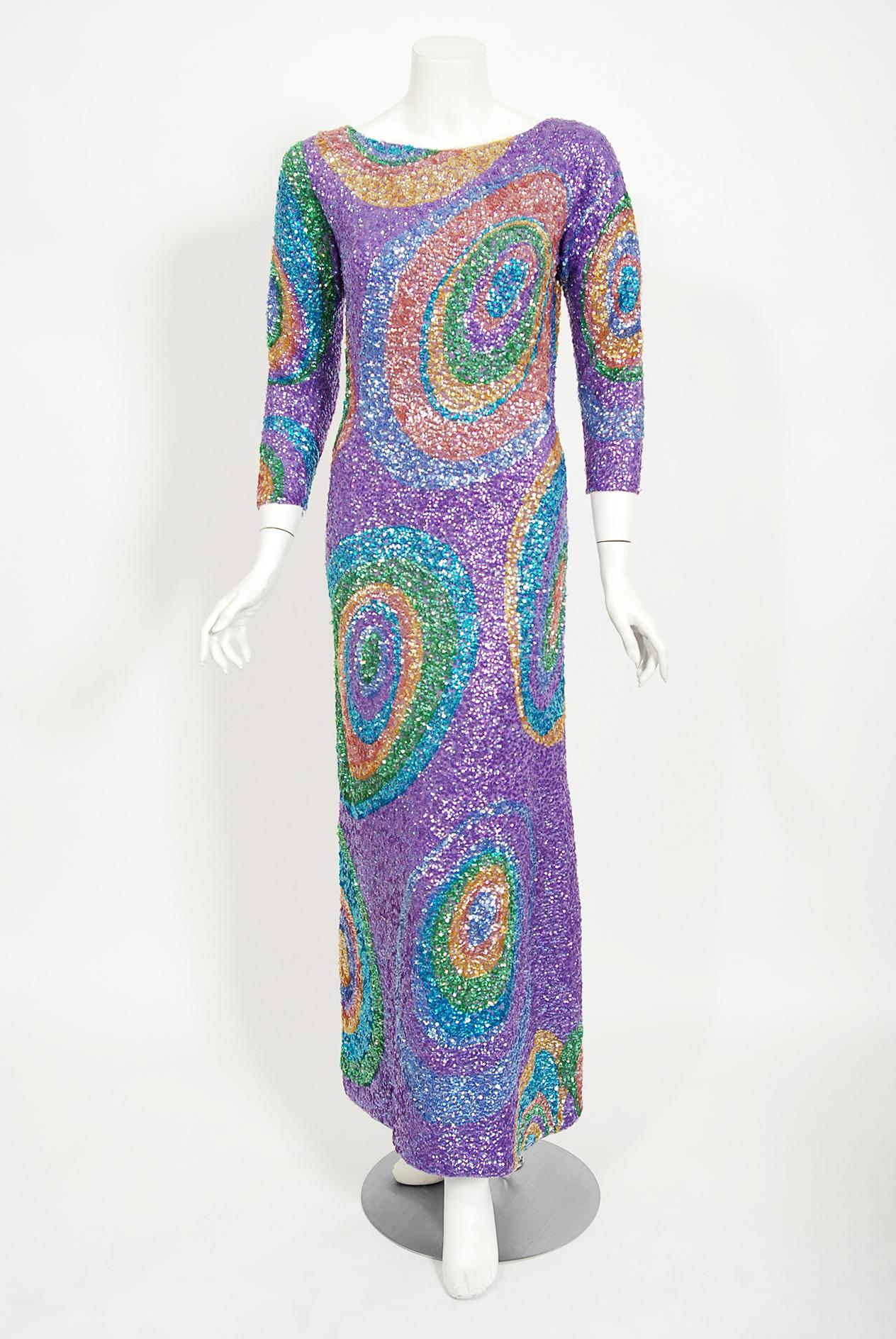Mid-century Gene Shelly designer garments are in a class of their own. They are always fully-sequined by hand and fit to flatter the figure. This early 1960's treasure has a fantastic graphic atomic swirl design in the most beautiful colors. The