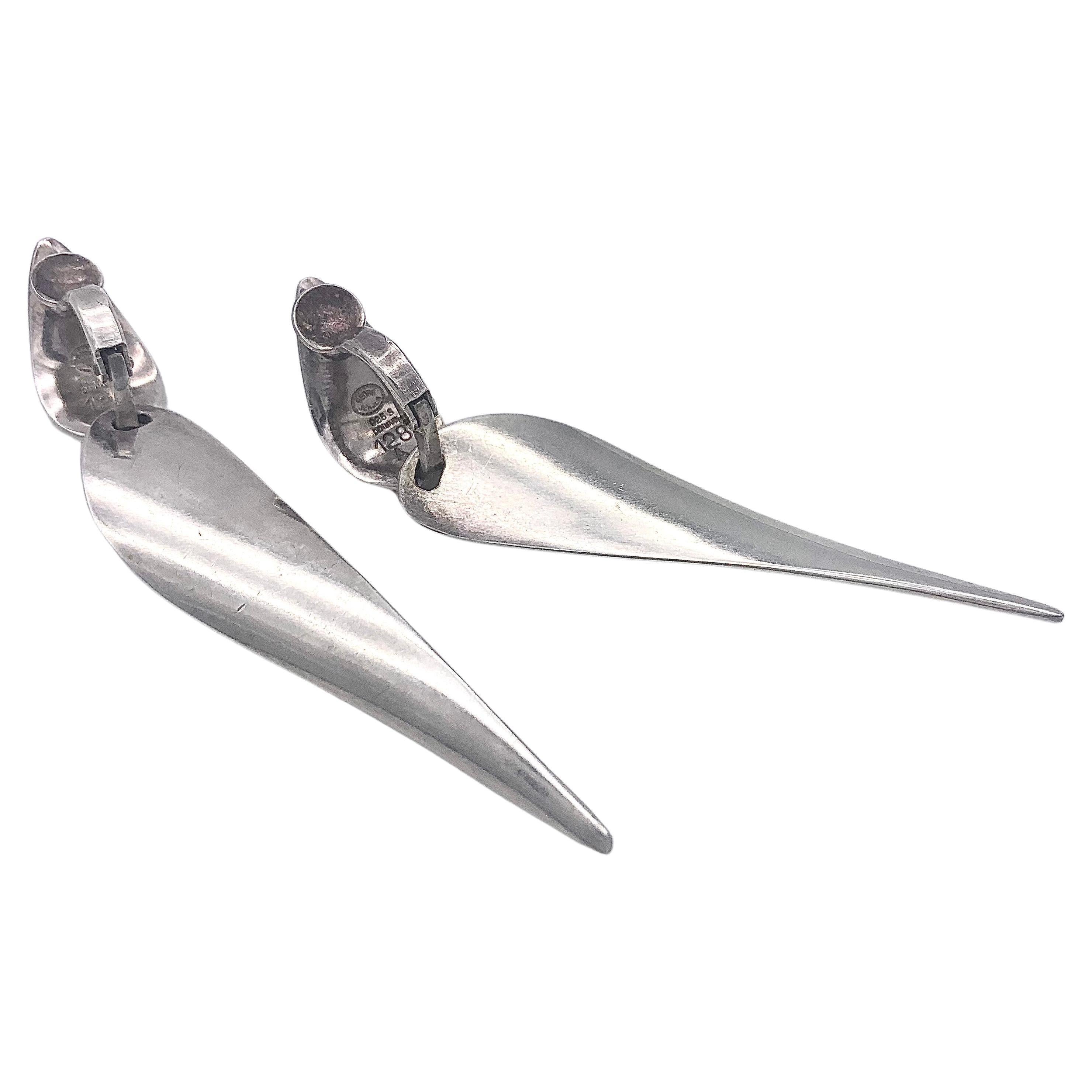 These very elegant sterling silver dangling clip-on earring were designed by Nana Ditzel and executed by Georg Jensen, Denmark in the 1960's. They are fully signed and numbered 128 A.
Nana Ditzels avant garde designs influenced generations of