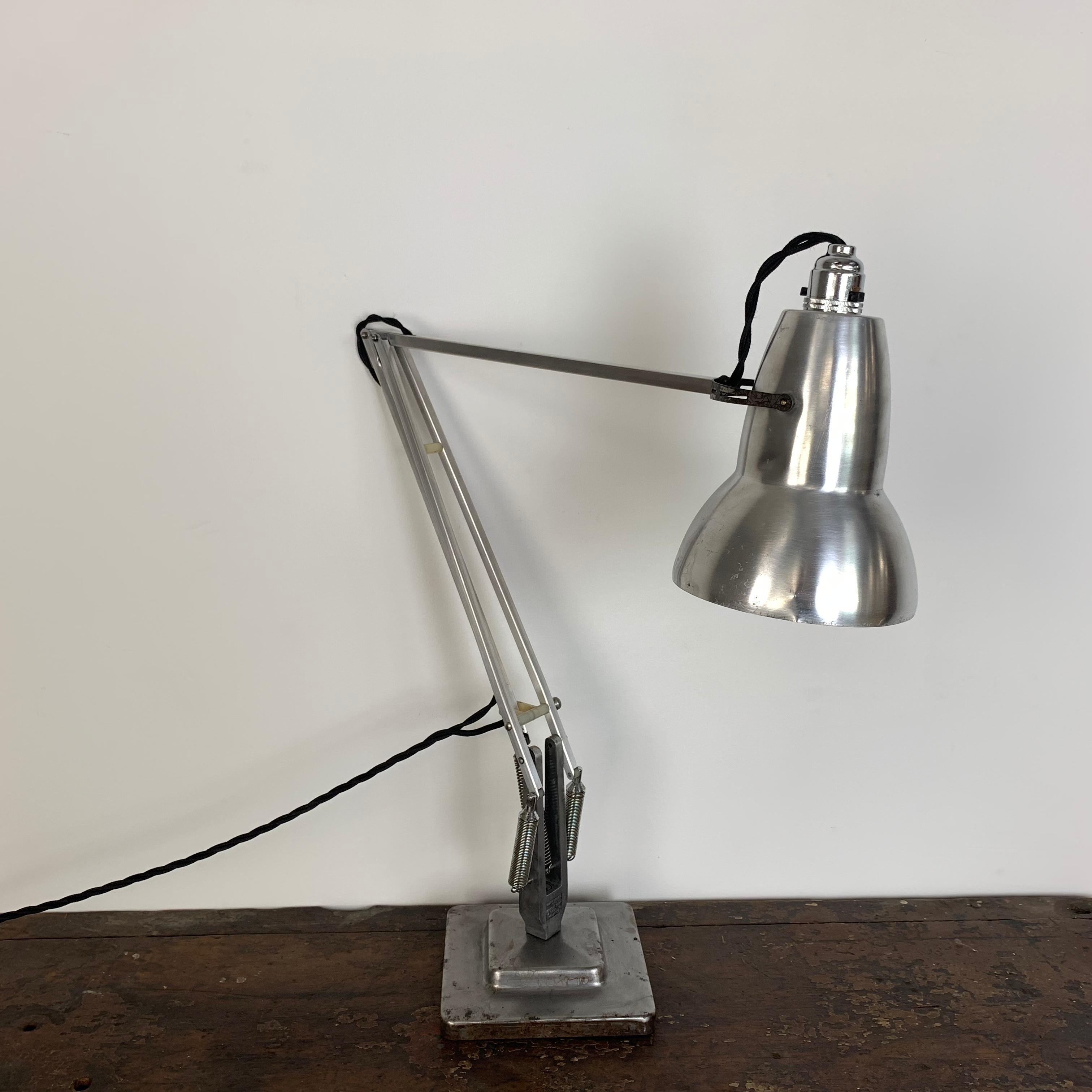 Designed by George Carwardine for Herbert Terry & Sons and made in Redditch, England, this is a lovely example of an original 1930s designed Herbert Terry Anglepoise.

With a tulip shade, two-stepped base and adjustable springs, this is a 1960s