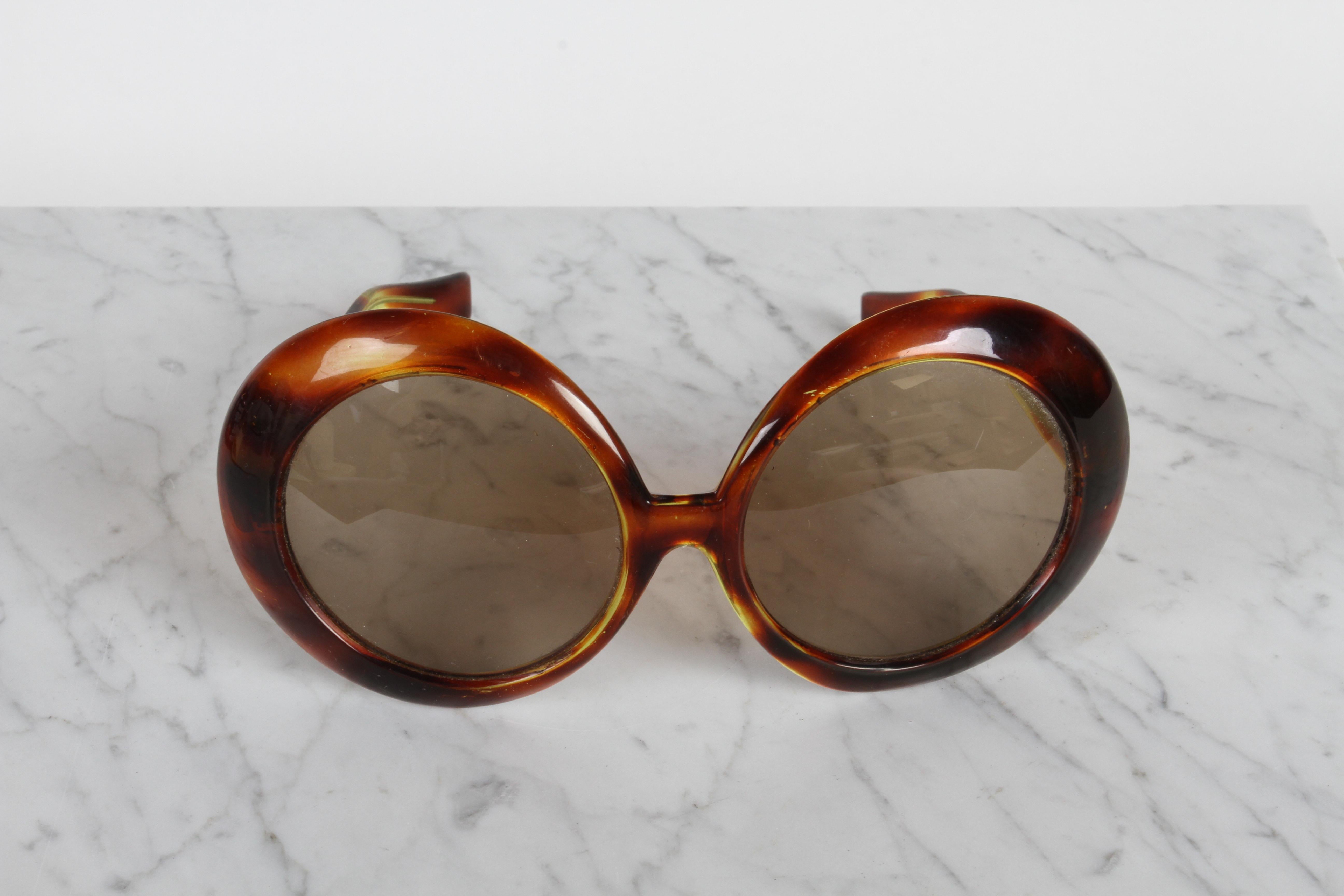Wonderful circa 1960s women's oversized tortoise frame sunglasses. Marked made in Italy on arm. Inside dims between arms is 5.5/8