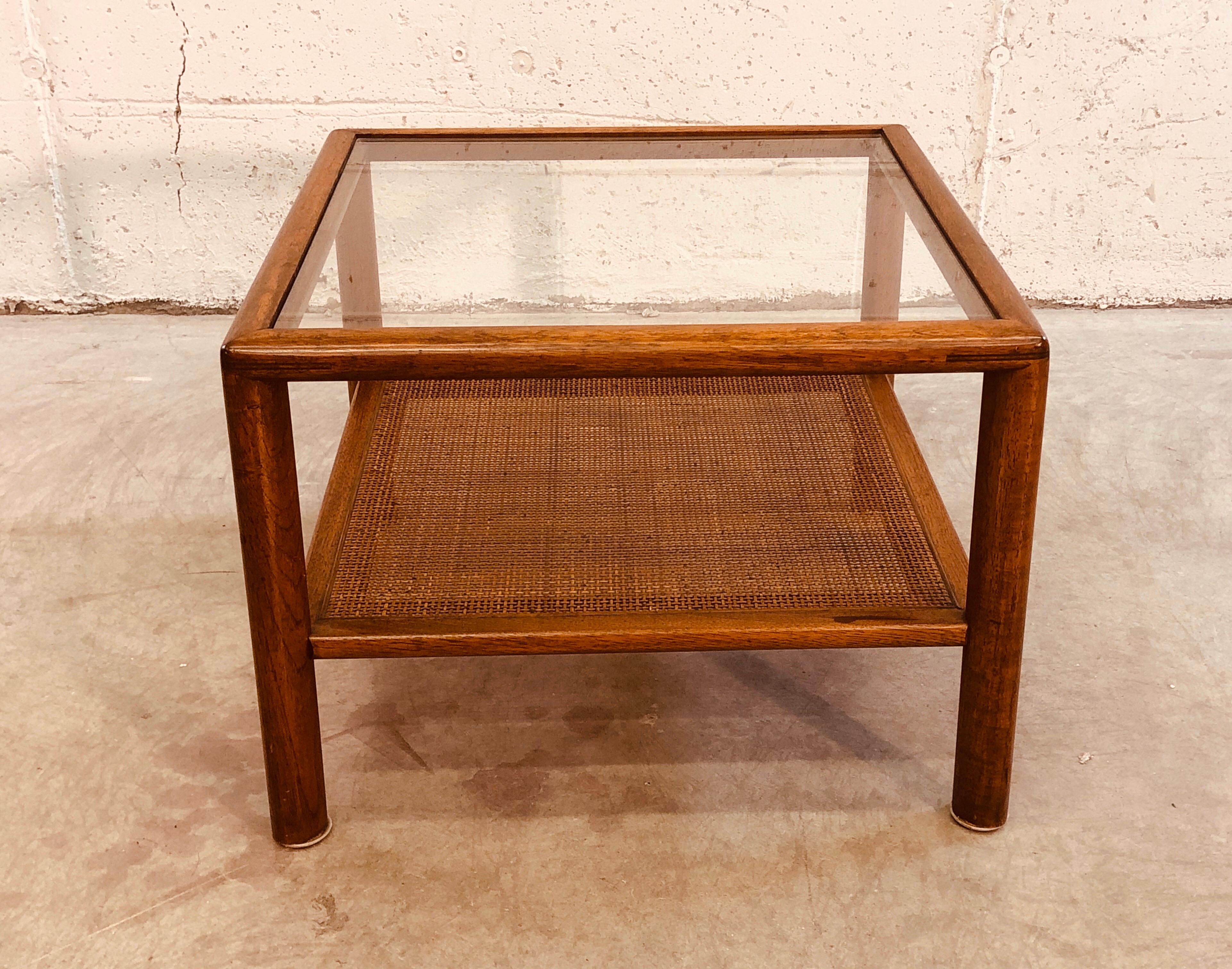Vintage 1960s small square glass top side table with a caned shelf. The wood is mahogany and the cane is in excellent condition. No marks.