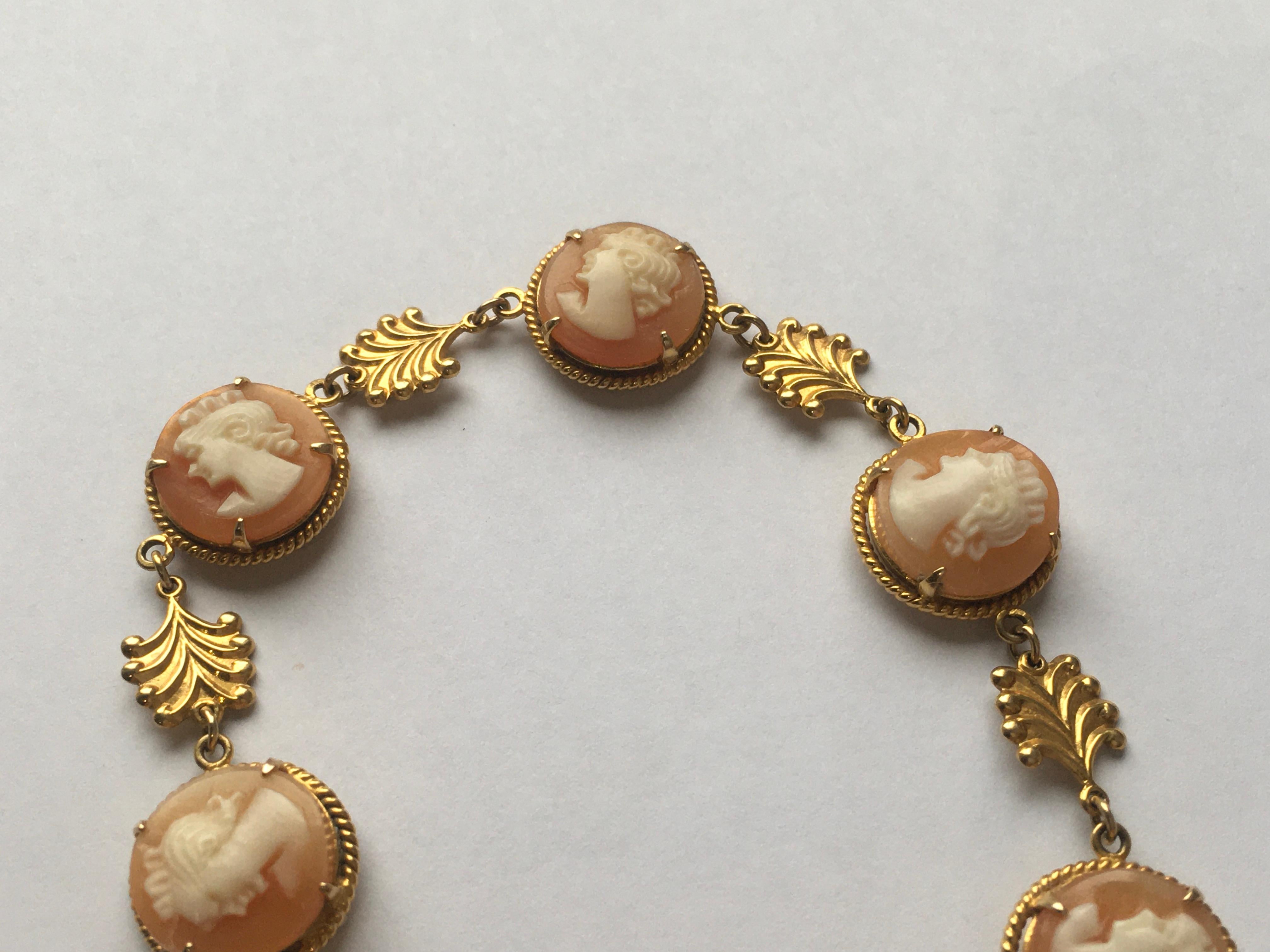 Vintage bracelet set with 6 round cameos with fancy gold divider links.
Approx 7 inches long
With safety chain
Hallmarks Birmingham UK 1965 
In very good condition 
Weight 10.1 grams