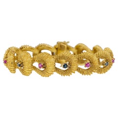 Pulsera vintage de oro de los años 60 con rubíes y zafiros