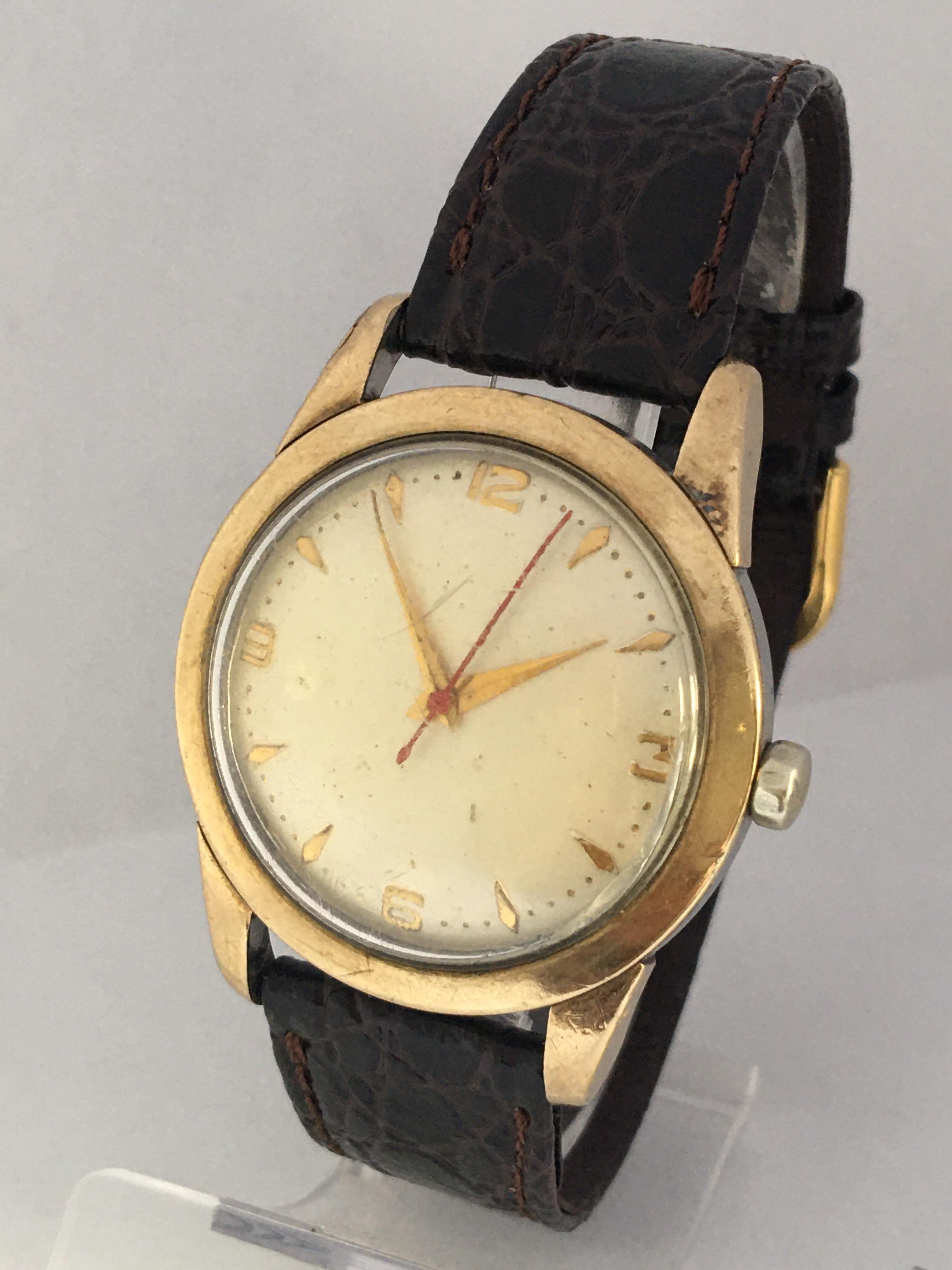 This pre-owned 35mm diameter vintage hand winding watch is in good working condition and it is running. Visible signs of ageing and wear with some cracks and scratches on the glass as shown. Some small scratches on the watch case as shown. 

Please