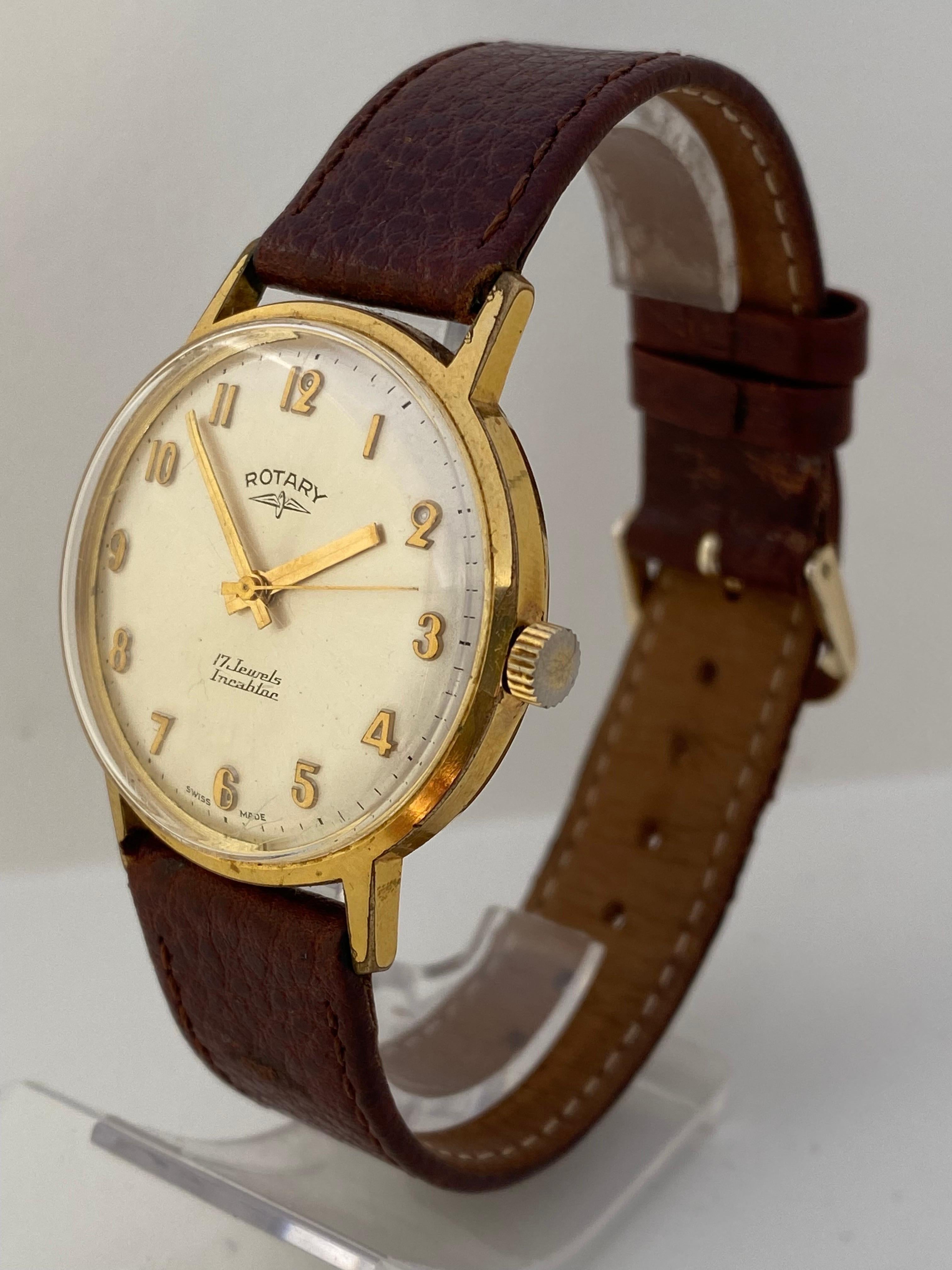 This beautiful 35mm diameter hand winding Swiss mechanical watch is in good working condition and it is running well. Visible signs of ageing and wear with very tiny light marks on the glass surface and on the gold plated and stainless back watch