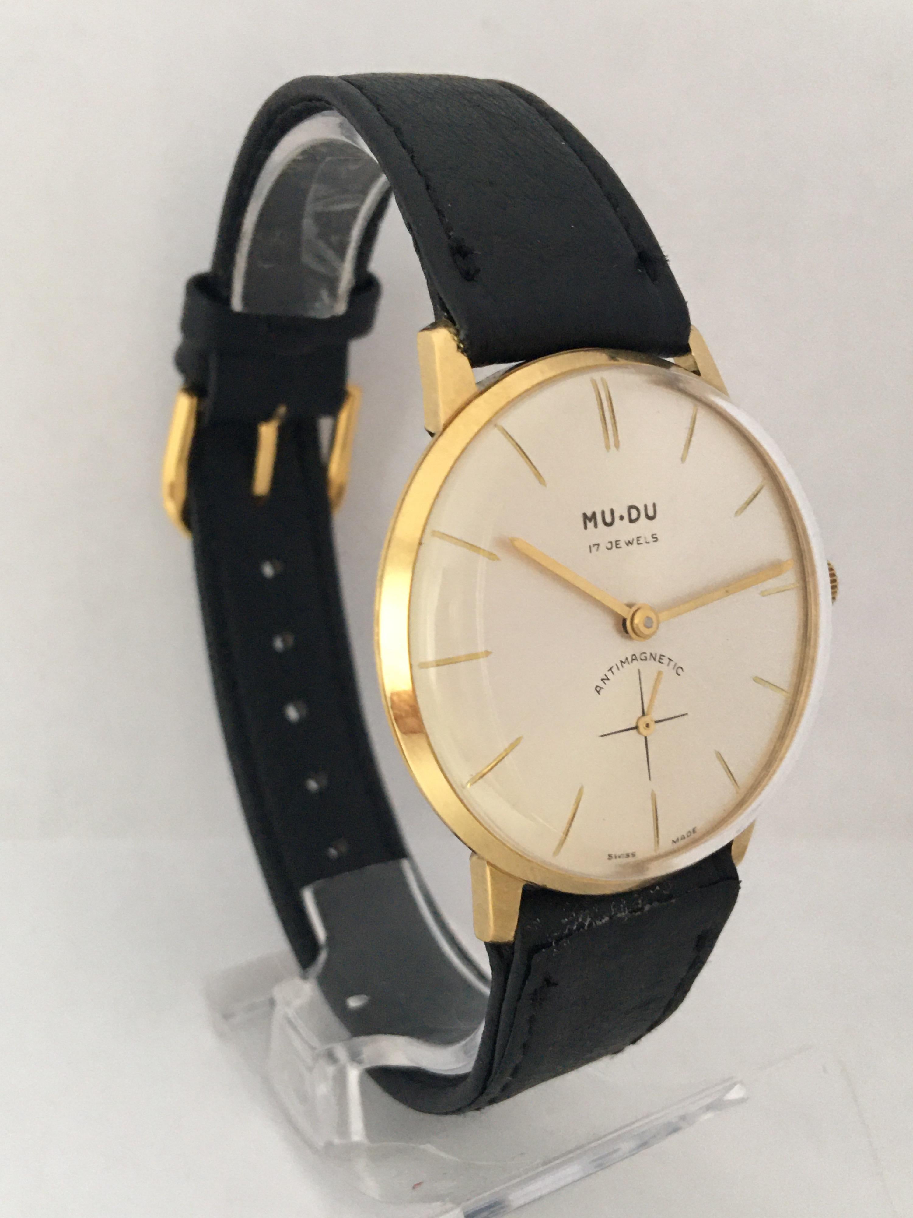 This classic 34mm diameter pre-owned hand winding watch is in good working condition and it is running well. The watch is in excellent condition as shown. The black leather strap is a bit used but still wearable. Please study the images carefully as