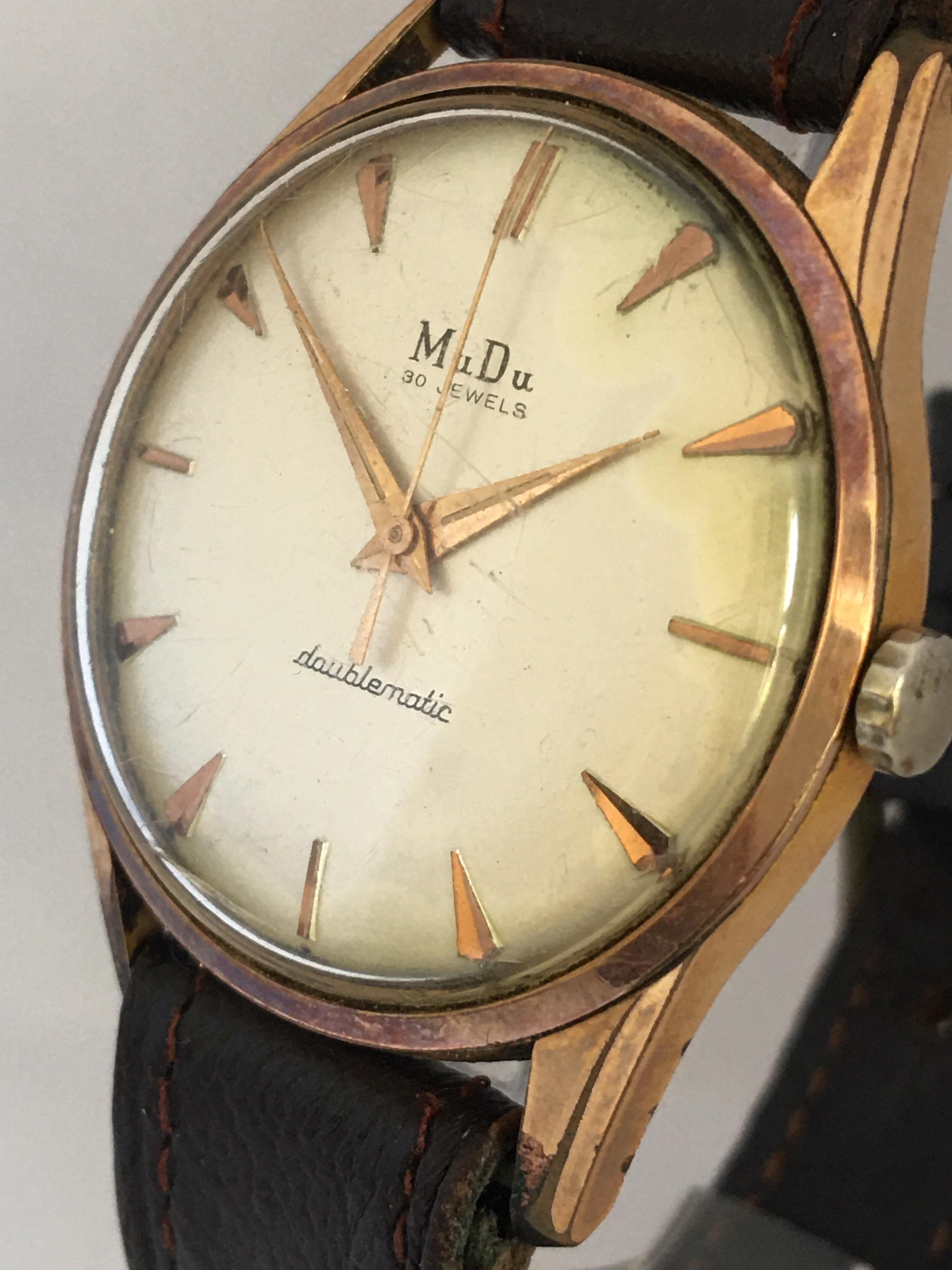 This charming pre-owned vintage gents automatic watch is working and it is running well. Visible signs of wear and ageing with a slight scratches on the watch glass and visible tiny crack on the glass as shown. The gold plated watch case shows some