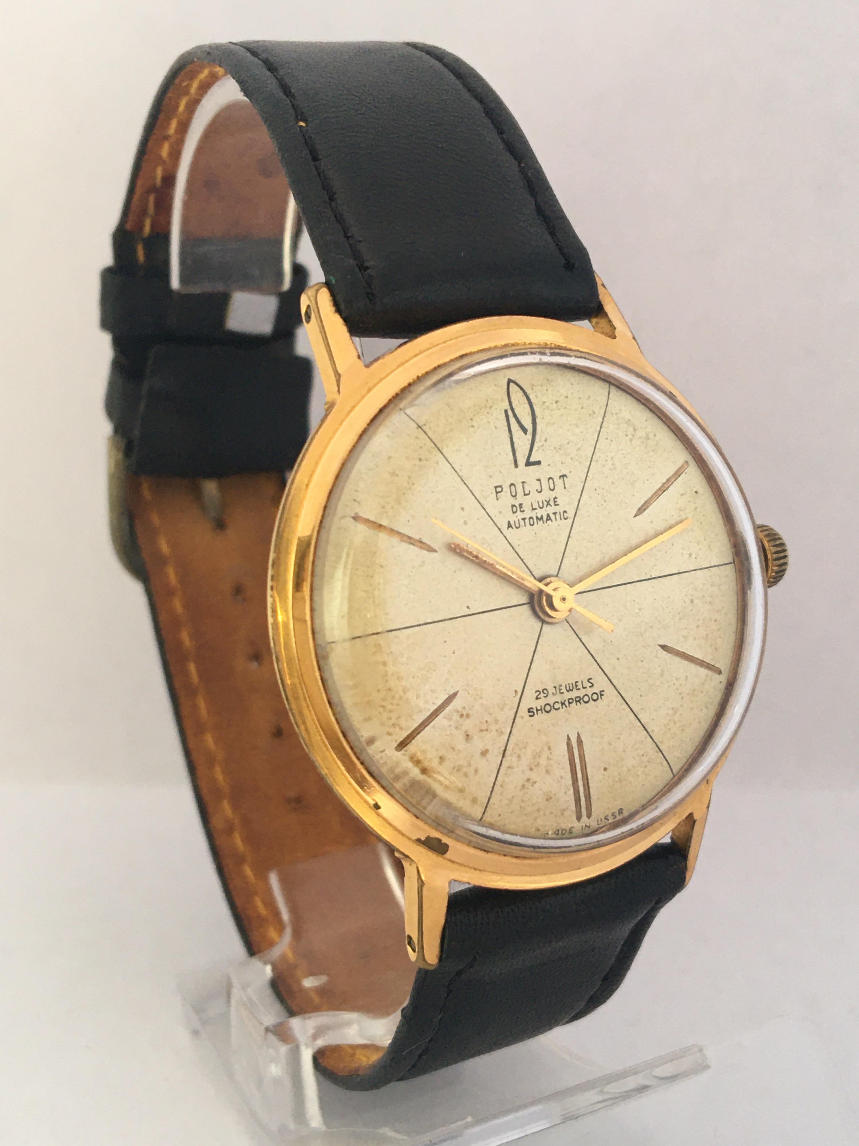 This beautiful pre-owned automatic watch is in good working condition and it is running well. It keeps a good time. Visible signs of ageing and wear. Some small dotted marks on the antique white colour dial(beige) watch case is a bit tarnished on