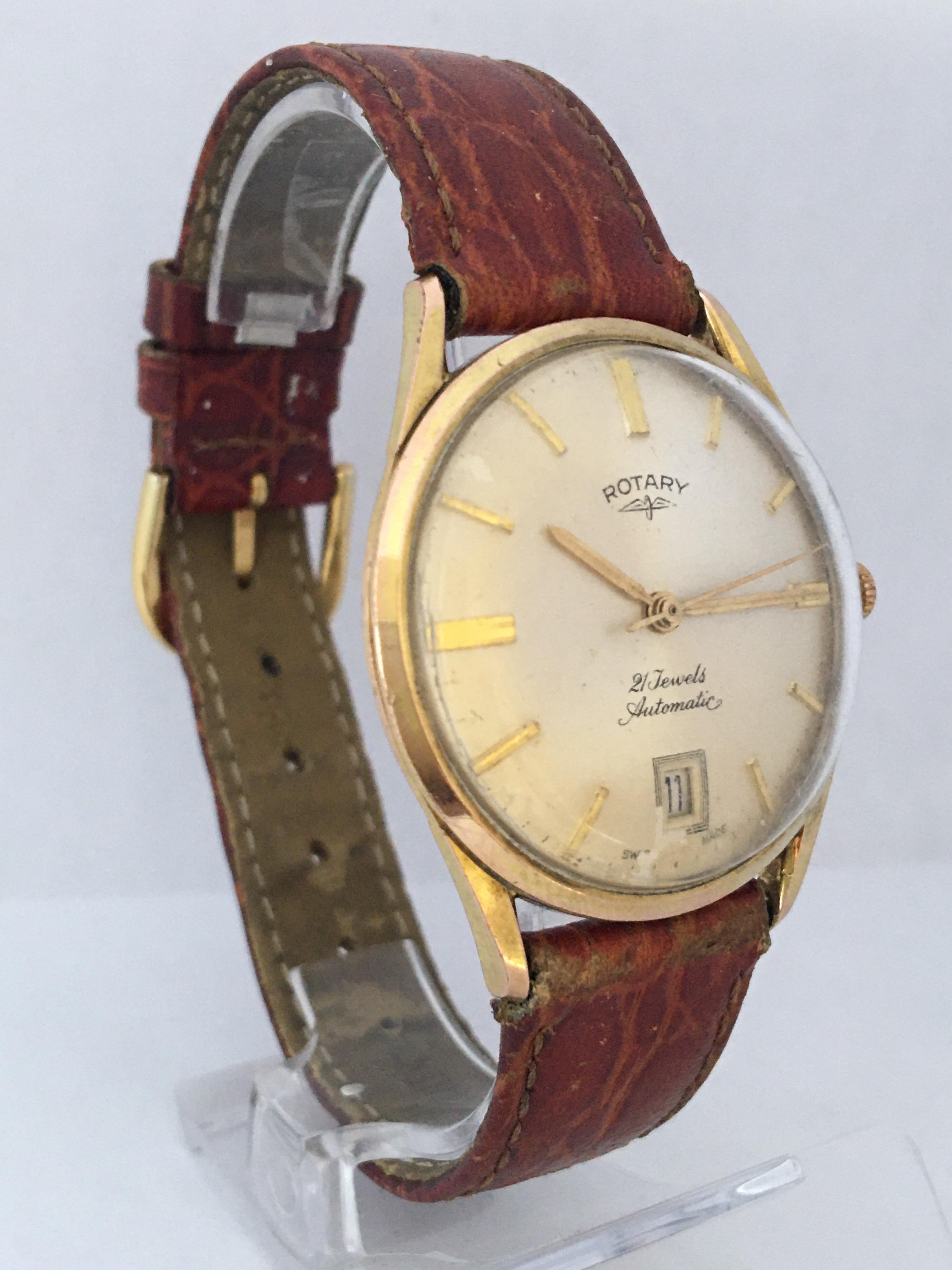 This beautiful pre-owned 35mm diameter vintage mechanical watch is in good working condition and it is ticking well. Visible signs of ageing and wear with light scratches and tarnished on the watch case as shown. The dial and the watch strap are a