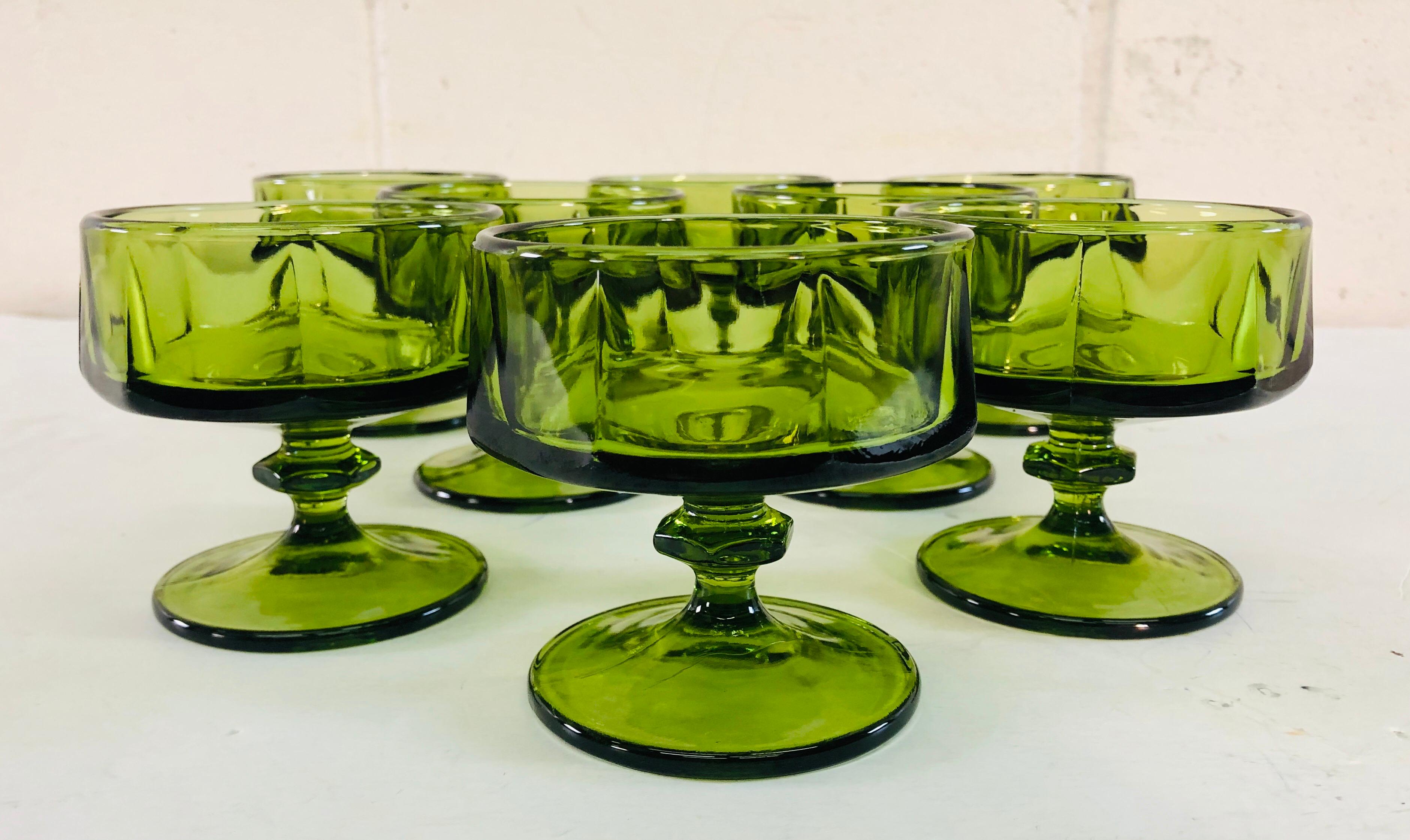 Vintage Mid-Century Modern set of 8 green glass low coupes. Solid glass with good weight. No marks. Excellent condition.