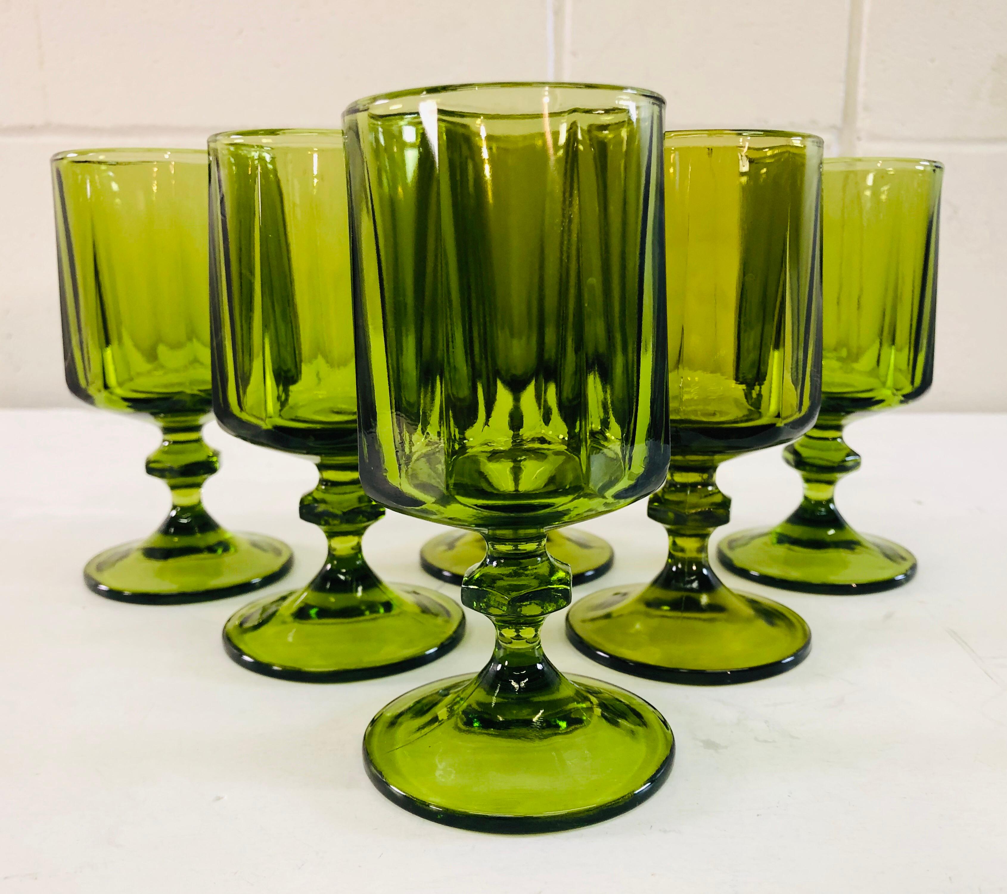 Vintage Mid-Century Modern set of 6 green glass wine stems. Solid glass with good weight. No marks. Excellent condition.