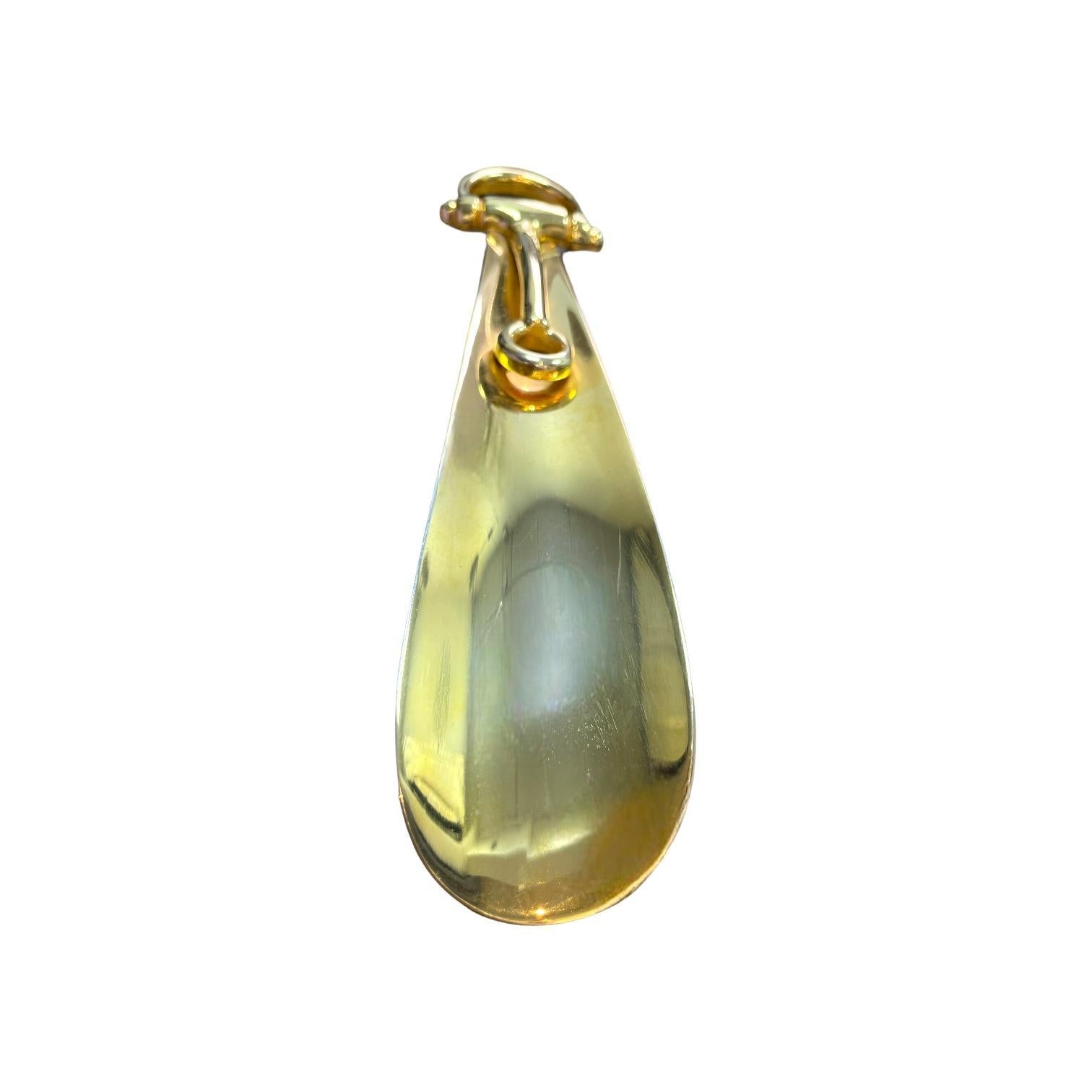 Step back in time with this exquisite Vintage 1960s Gucci Gilt Bronze Shoe Horn. Crafted in Italy, this elegant piece showcases the luxurious craftsmanship and timeless design Gucci is renowned for. The gilt bronze finish adds a touch of opulence,