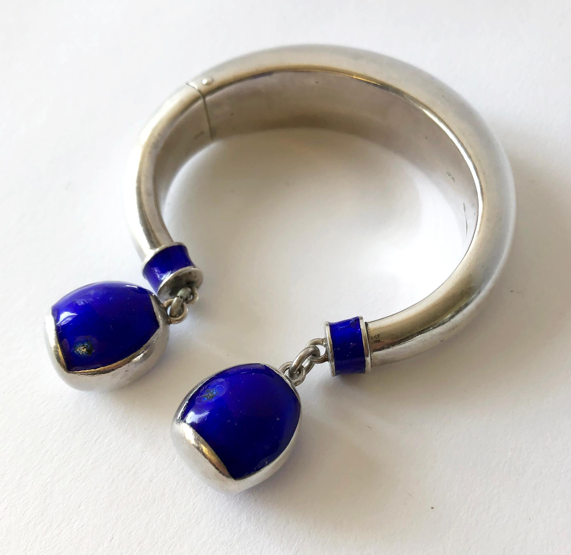Vintage sterling silver and enamel hinged bracelet created by Gucci, circa 1960's.  Bracelet has a 7 1/4