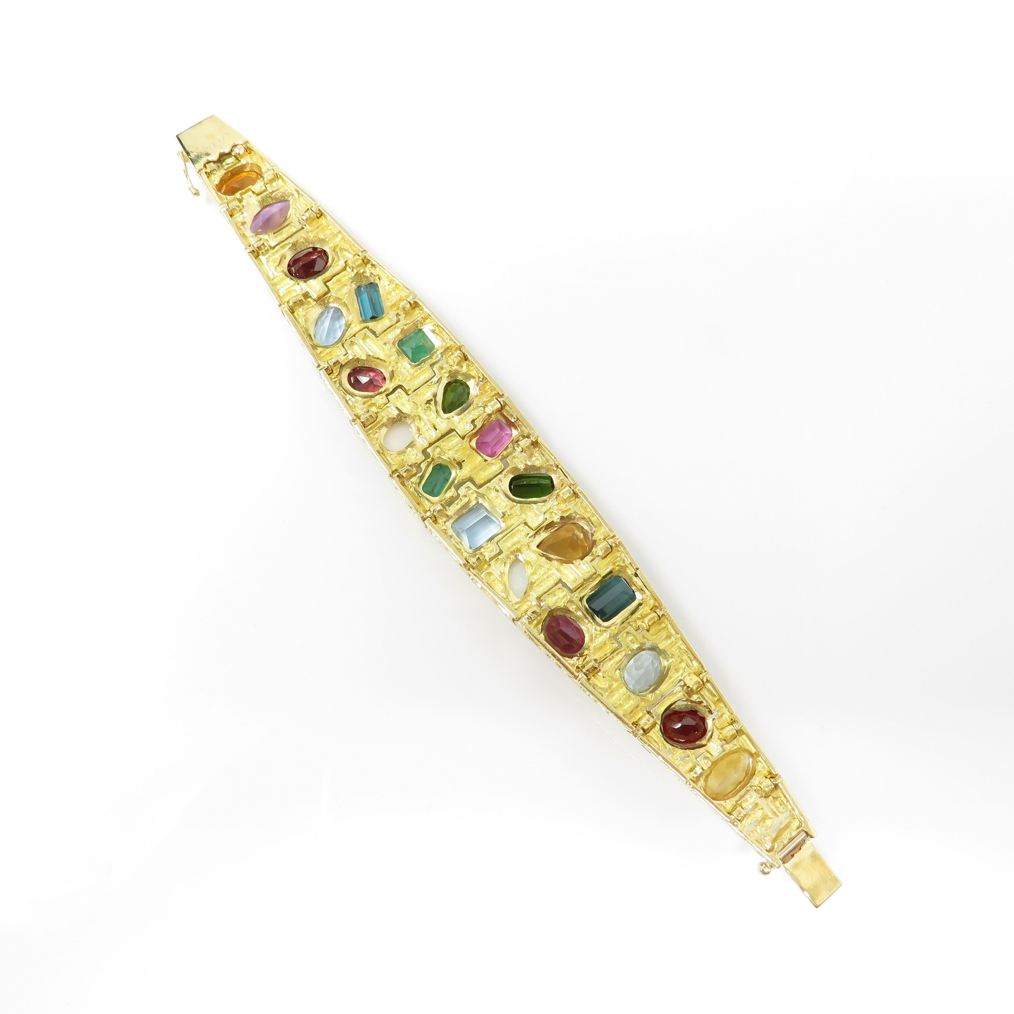 This stunning well made heavy midcentury retro designer bracelet by H. Stern (Brazil) is set in thick heavy 18kt bright yellow gold. The width of the bracelet cuff is 2 1/16 inches to 5/16 inches.  The bracelet is 6.75 inches long (perfect size to