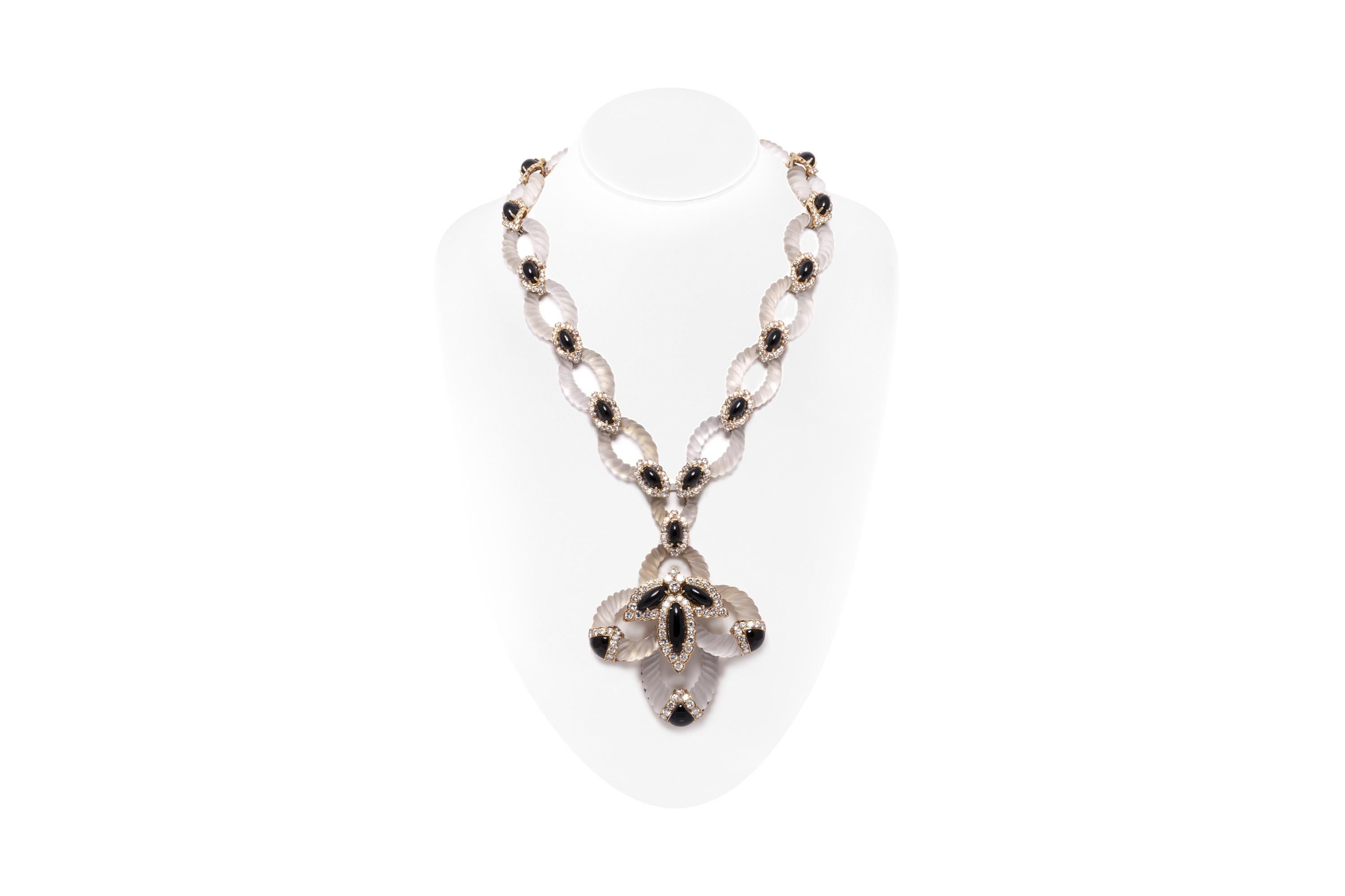 Finely crafted in 18k yellow gold with carved Crystal and Cabochon Black Onyx. The set also features Round Brilliant cut Diamonds weighing a total of approximately 29.00 carats.
Signed by Hammerman Brothers
Circa 1960s
Necklace 20 inches
Pendant 4