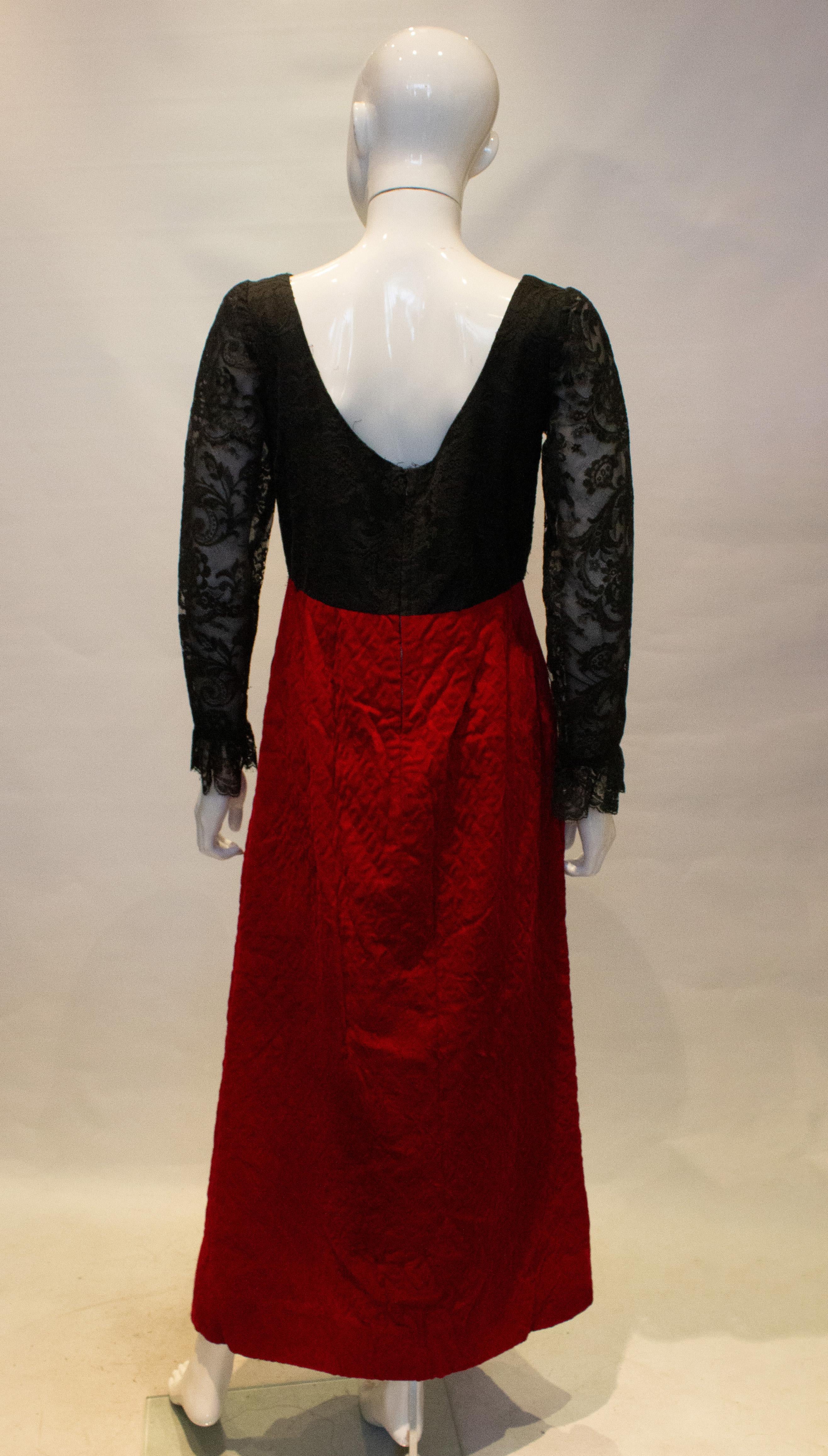 A great vintage evening dress for Fall /Winter by Irving Ross. The dress has a pretty black  lace bodice with a red quilted velvet skirt. Measurements: Bust 36'',length 54'' plus 4'' hem.