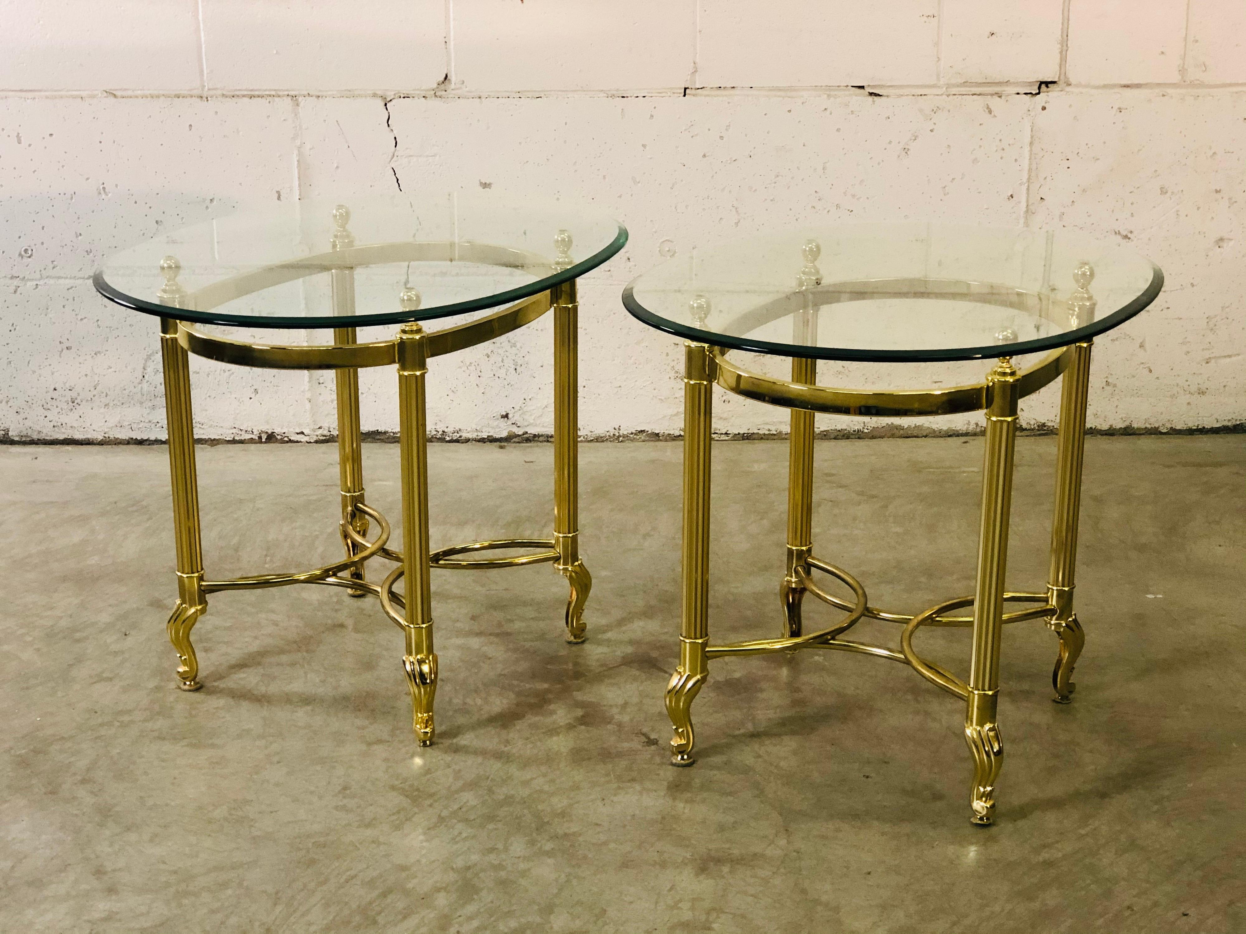 Vintage 1960s pair of brass and glass top side tables by LaBarge. The feet have a scroll design. Light tarnish from age in spots. No marks.