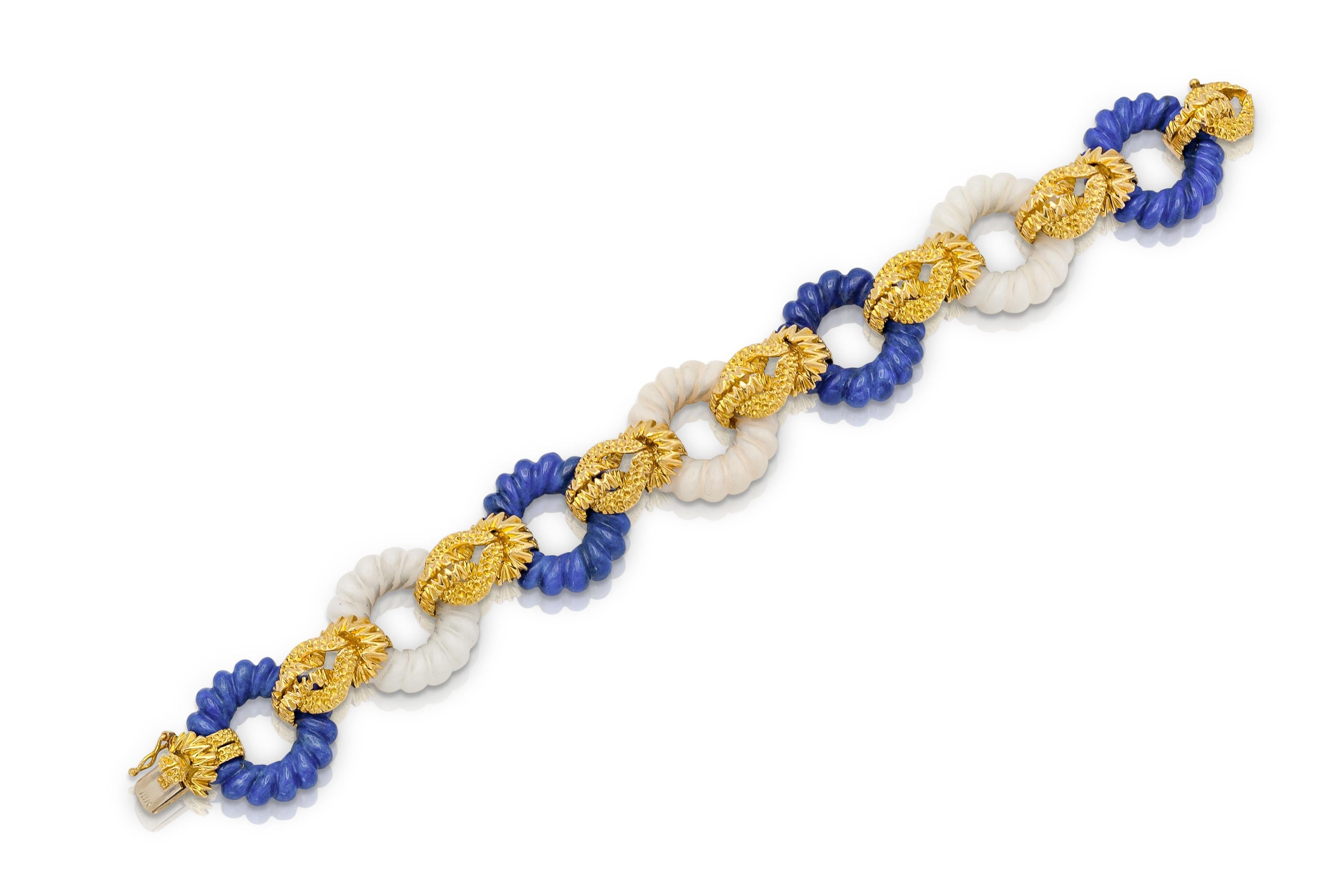 Finely crafted in 18k yellow gold with carved Lapis Lazuli and Bone circular links.
Circa 1960s
Size 7 inches