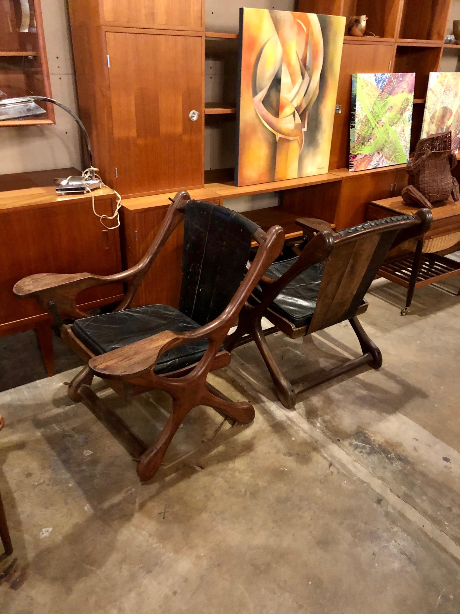 These vintage sling chairs by Don Shoemaker are in overall good condition. Distressed original leather. Cocobolo frame. Swinging sling chair. A few minor losses (see photos). Sold individually. Shipping cost is per item,
circa 1960s,