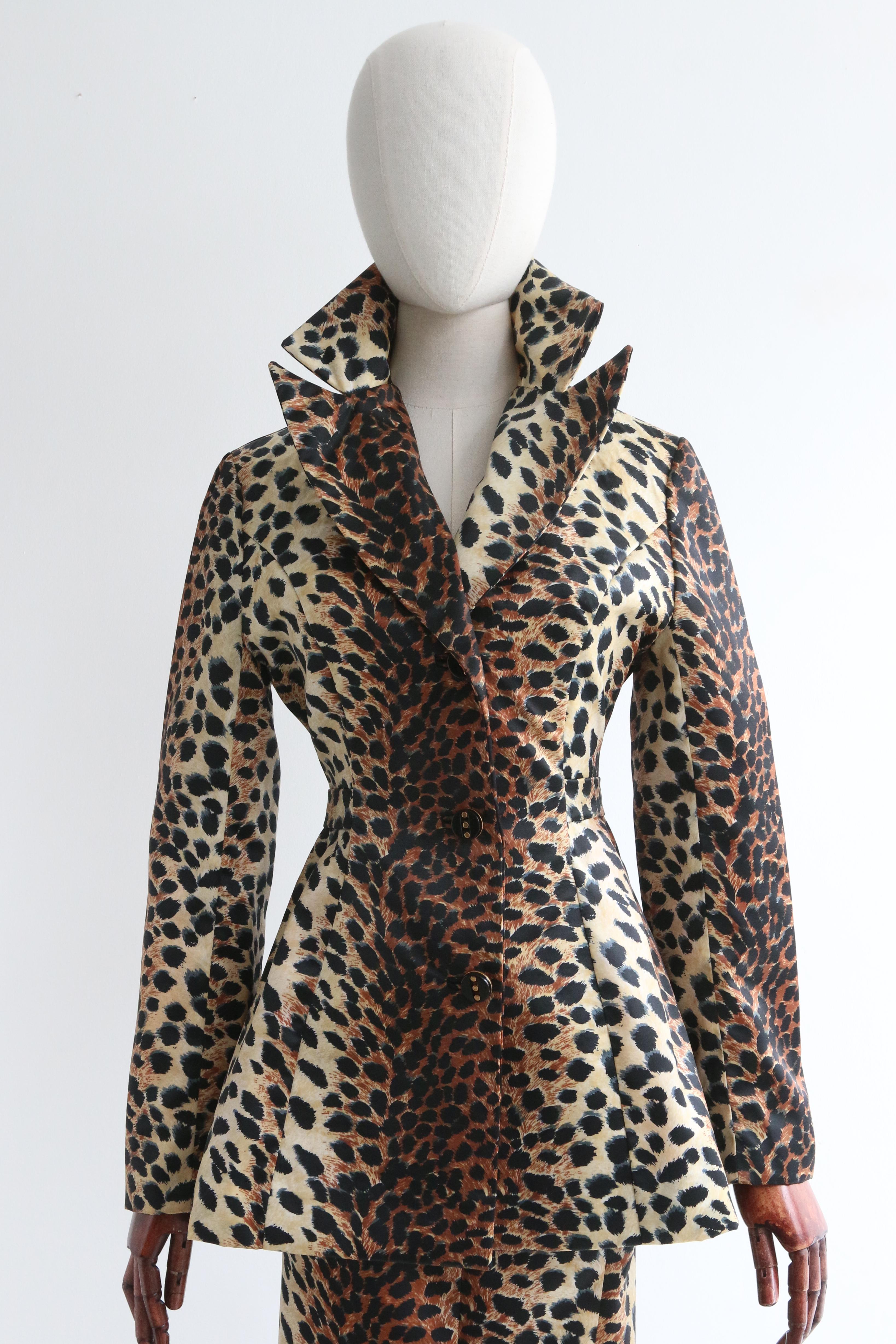 Rendered in a classic silhouette, this original late 1960's leopard print Lilli Ann skirt suit, is an iconic set for your statement wardrobe. 

The V shaped neckline of the jacket is framed by a wide notched collar and a simple shoulder line. The