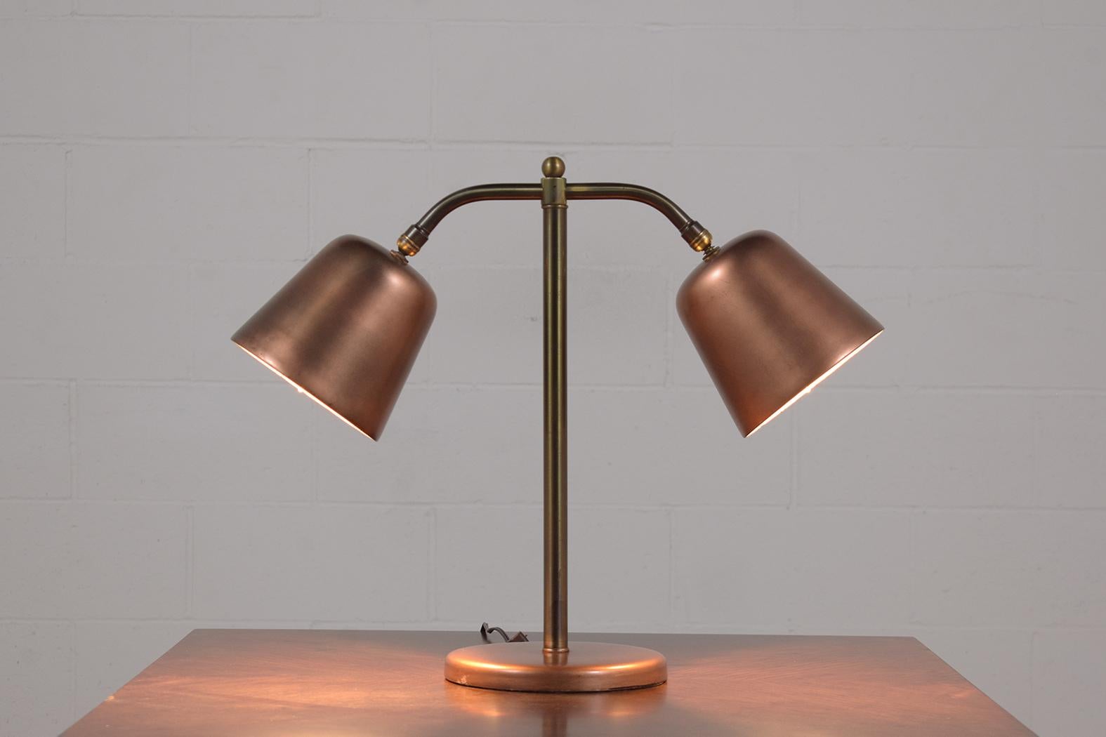This extraordinary Mid-Century Modern table lamp is in great condition is hand-crafted out of brass and has been newly restored and wired by our professional craftsman team in the house. This vintage table lamp is eye-catching and features a unique