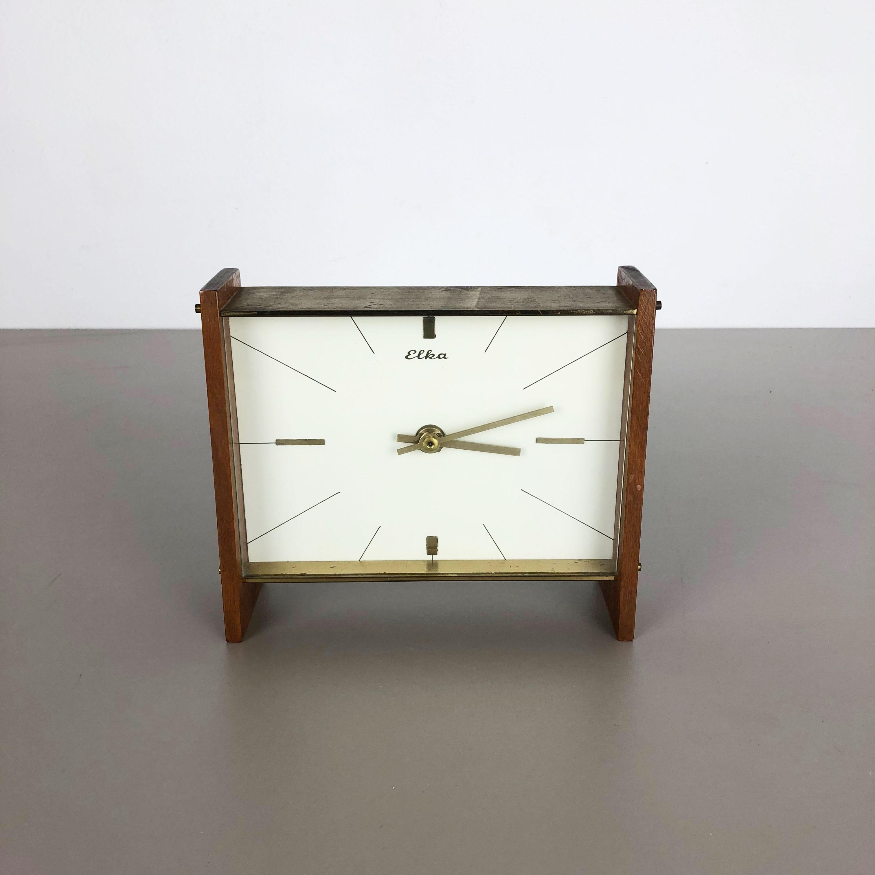 Article:

table clock



Origin:

Germany


Producer:

ELKA


Age:

1960s



Description:

this original wooden table clock was produced in the 1960s by the premium clock producer ELKA in Germany. The clock is original