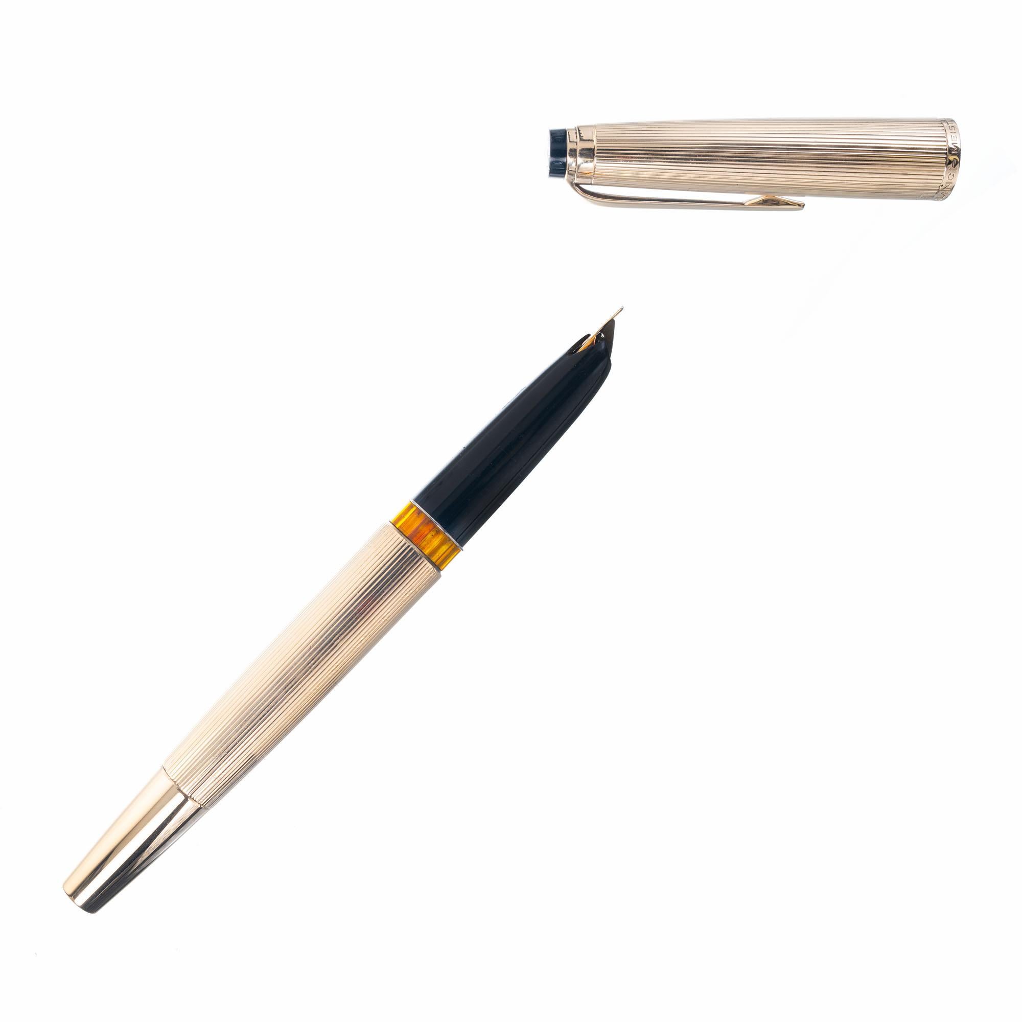 Monteblanc Meisterstück #94 solid 14k fountain pen with solid Monteblanc solid gold nib. Piston type. Pen and cap both stamped 585 for 14k yellow gold. Comes with a new bottle of Montblanc mystery black Ink.

14k yellow  Gold
Stamped: 585
Hallmark: