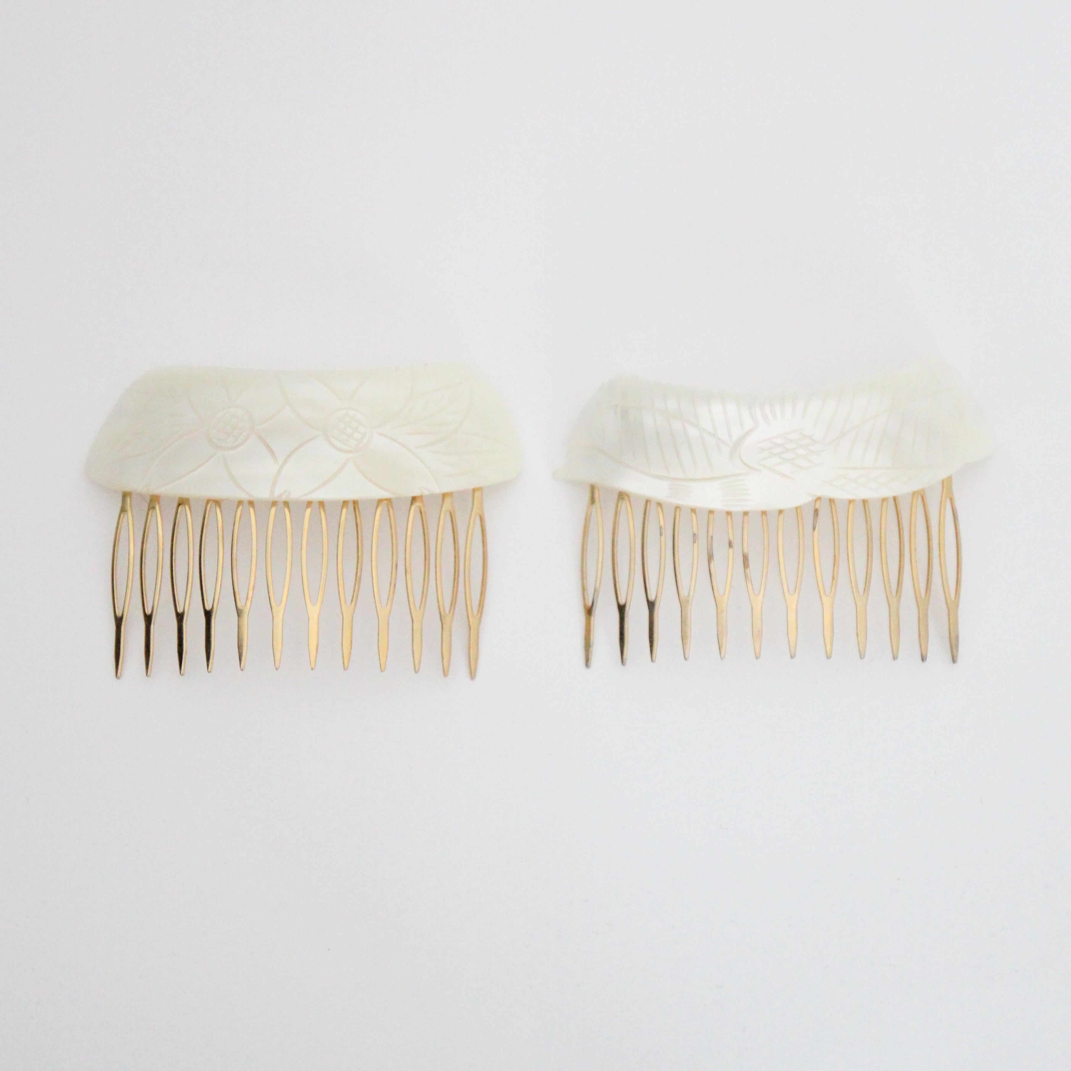 This wonderful pair of 1960's hair combs, decorated with curved and carved mother of pearl shells, are the perfect finishing touch to any outfit. Each hair comb boasts a different design, one with carved flowers with smooth edges, and the other a