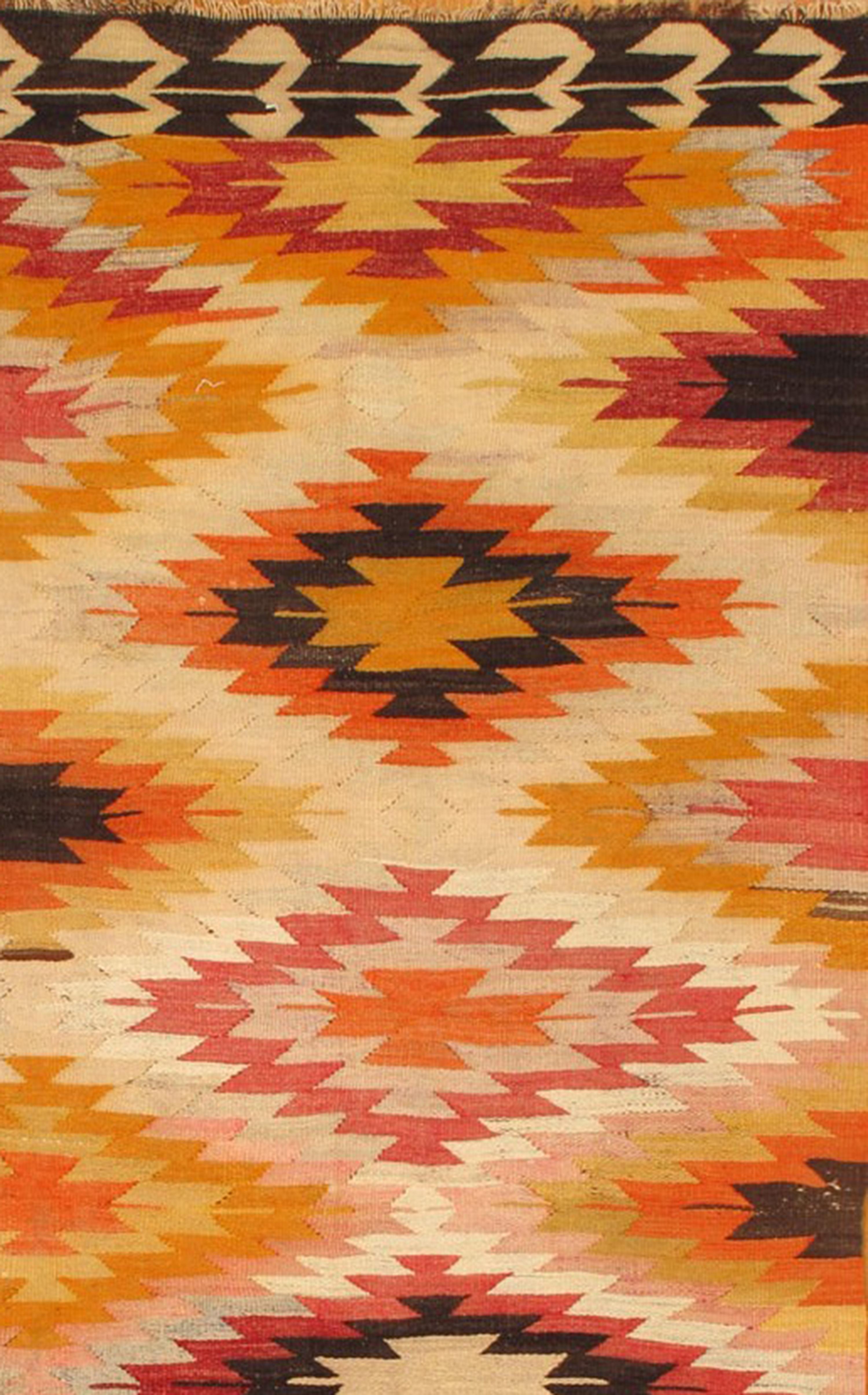 Vintage 1960s Turkish kilim rug with a multicolor all-over geometric design. Measures: 6.02 x 11.
