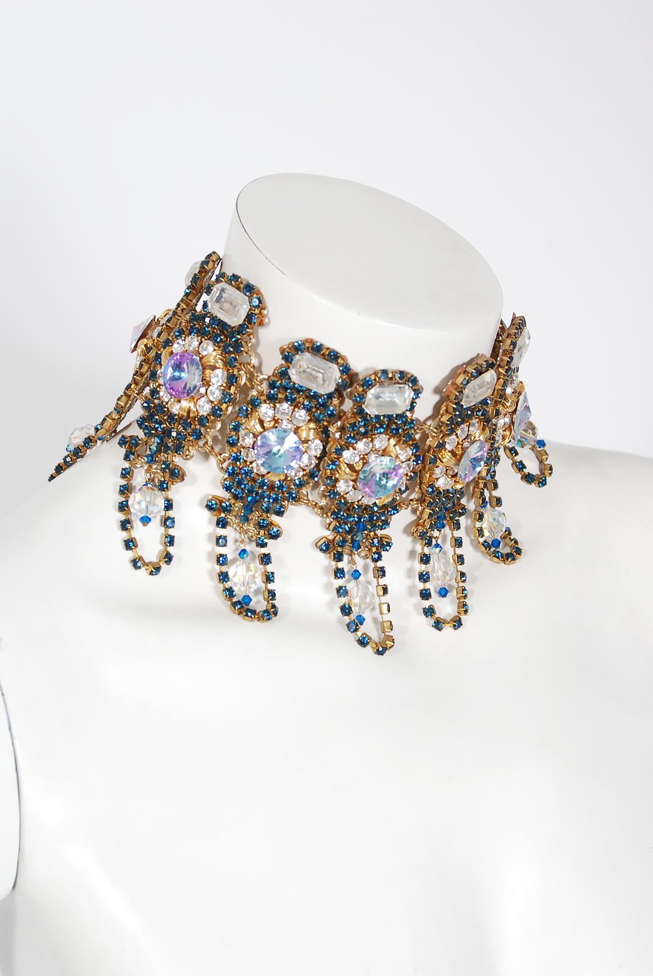 Spectacular 1960's multicolored bib statement necklace, comprised out of multiple strands of fringe glass beads and high-quality sparkling rhinestones. Gorgeous gold-tone metal base, all stones are prong set. I love the intricate lopped fringe