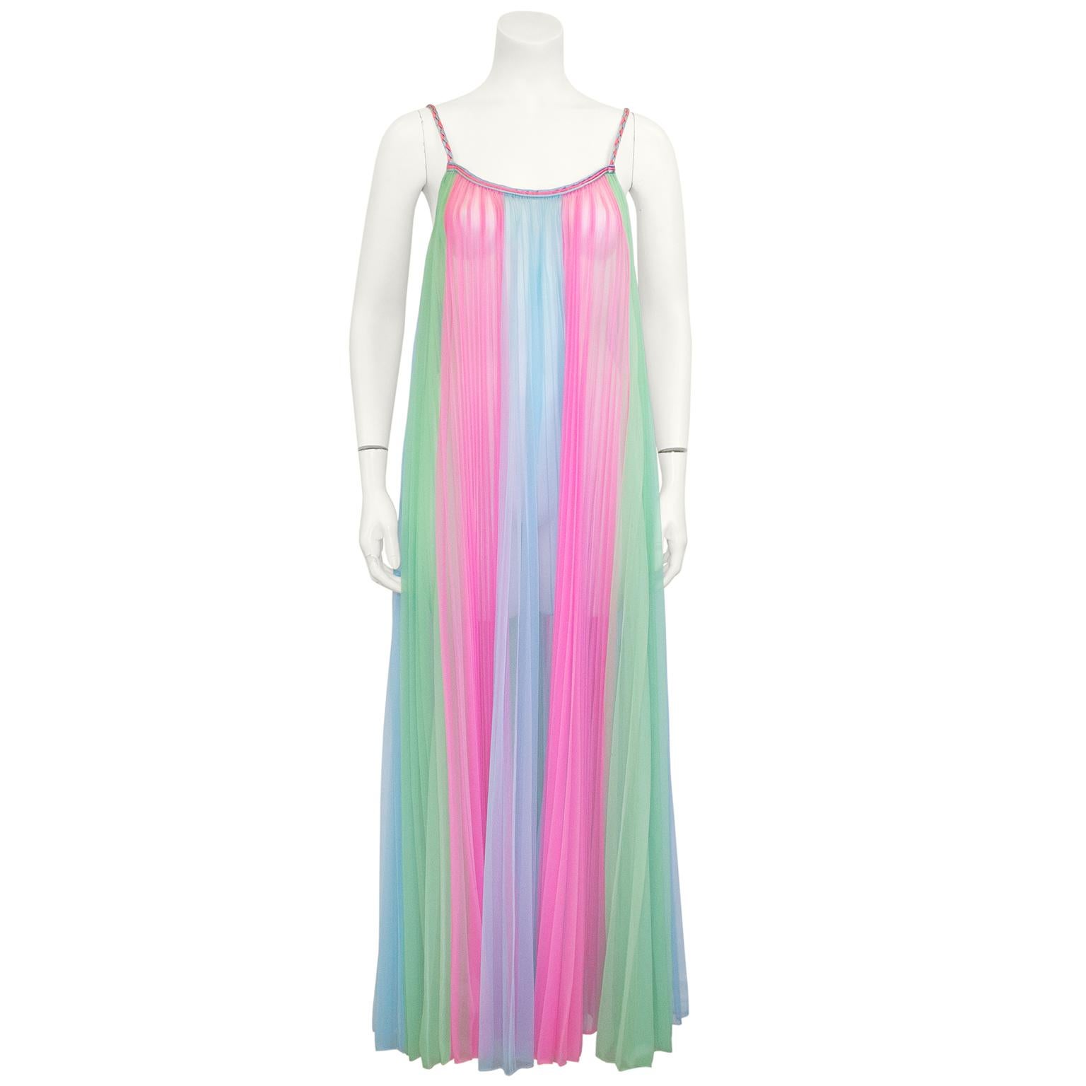 Irresistible 1960's pastel nylon peignoir set pleated from top to bottom. Adorable shades of pink, turquoise and green all piped in matching satin tri-color cord. The inside garment has a scoop neck and falls with a generous sweep to the ankle. The