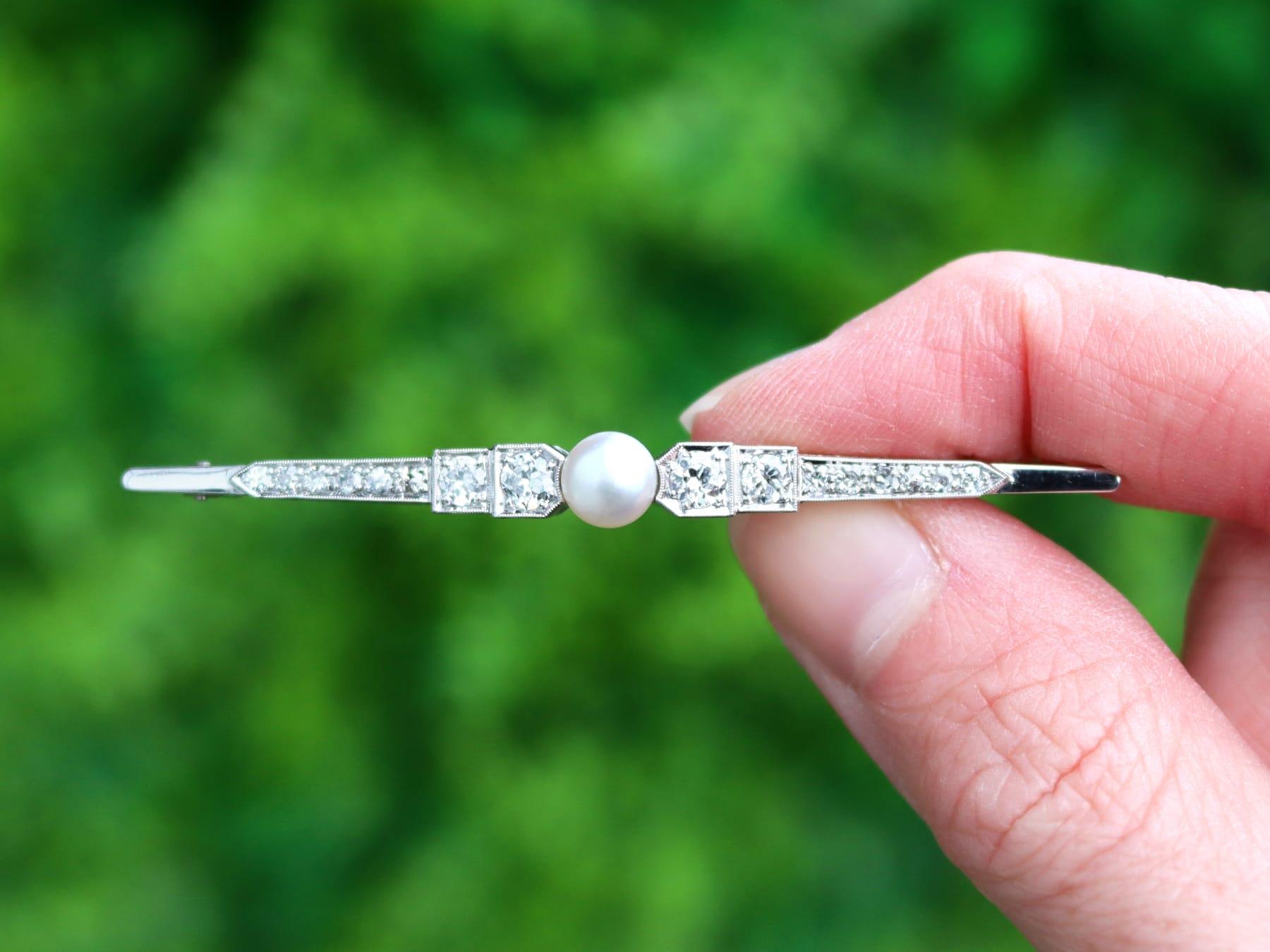 An impressive vintage Dutch Art Deco style pearl and 1.45 carat diamond, 14 karat yellow gold bar brooch; part of our diverse vintage jewelry collections.

This fine and impressive pearl and diamond brooch has been crafted in 14k white gold. 

The