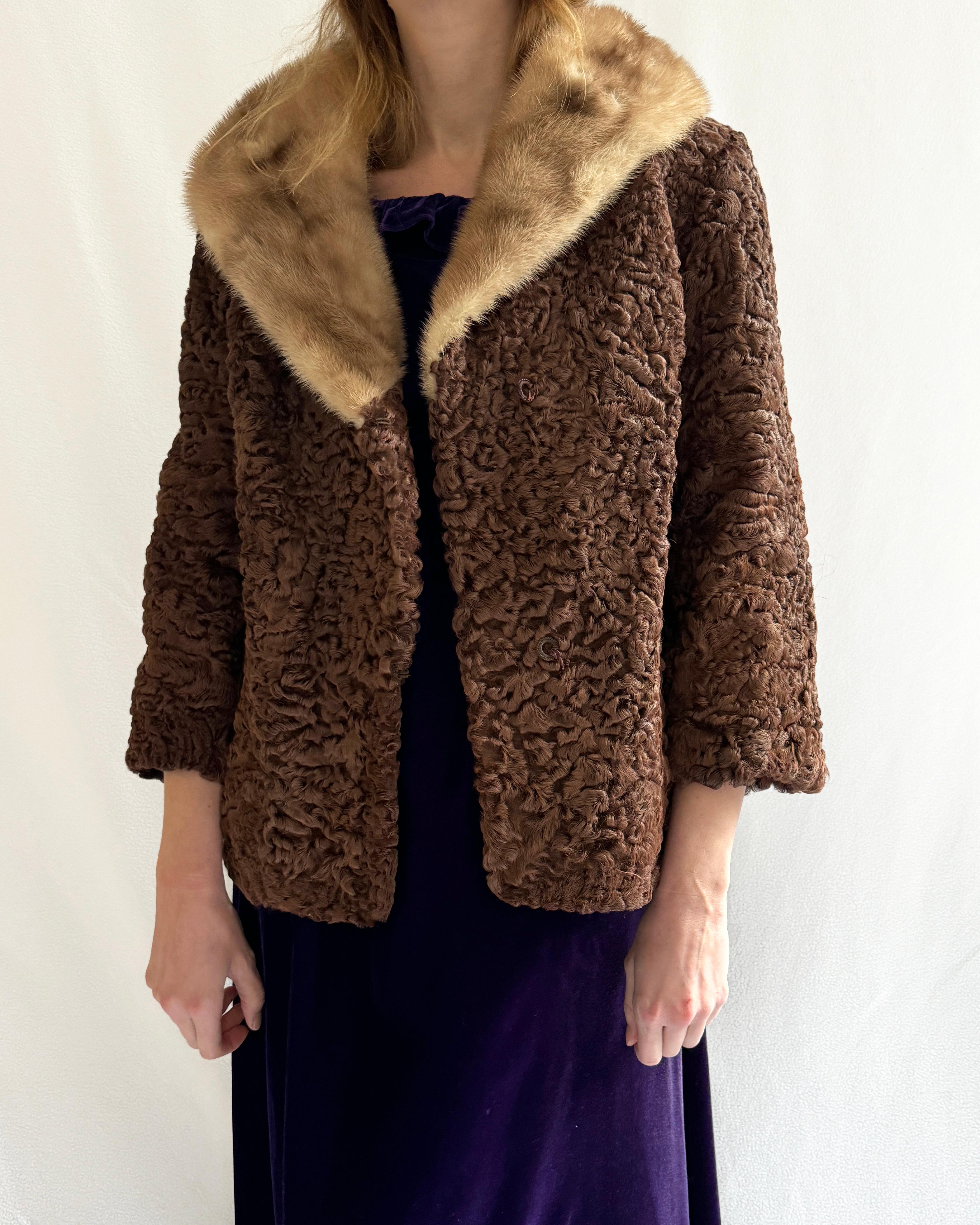 Made in the early 1960s, this vintage Persian lamb (broadtail lamb) coat is the most gorgeous chocolate brown color, with a blonde mink collar. These colors pair well with literally everything, including black. Persian lamb is such a coveted