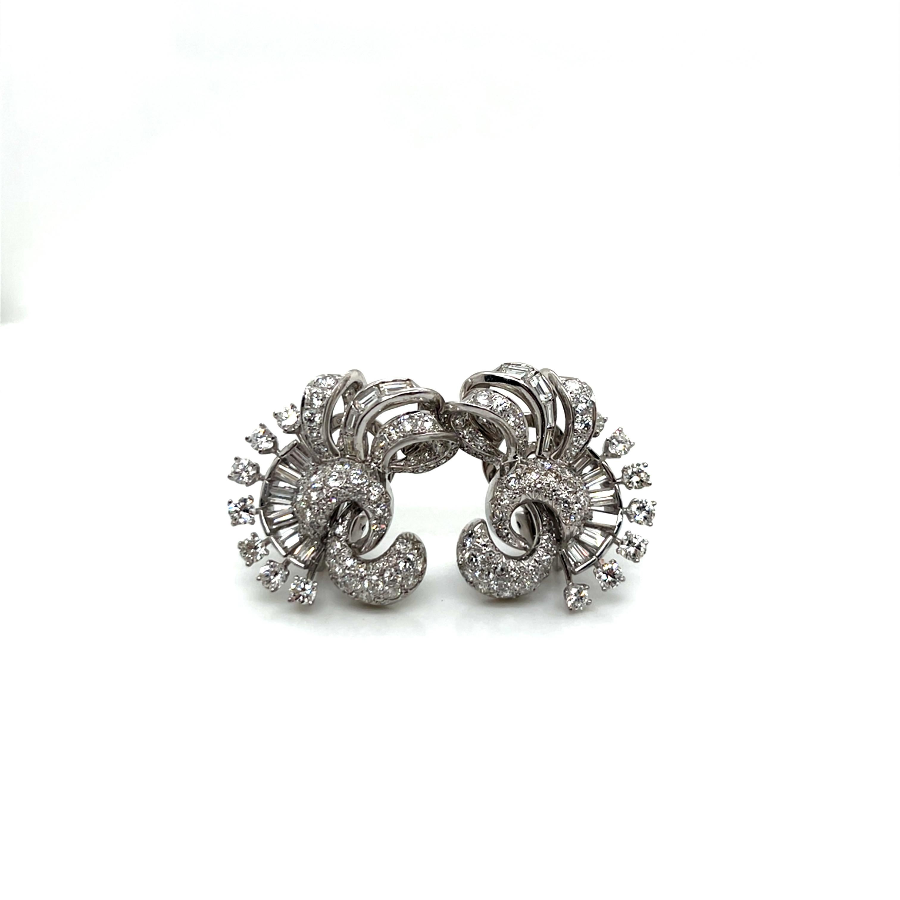 Vintage 1960's Platinum and Diamond Clip Earrings 4.50ct

These exquisite vintage clip earrings showcase the sophisticated glamour of 1960s jewelry design with their distinctive scroll motif and spectacular diamond pavé work. Crafted in lustrous