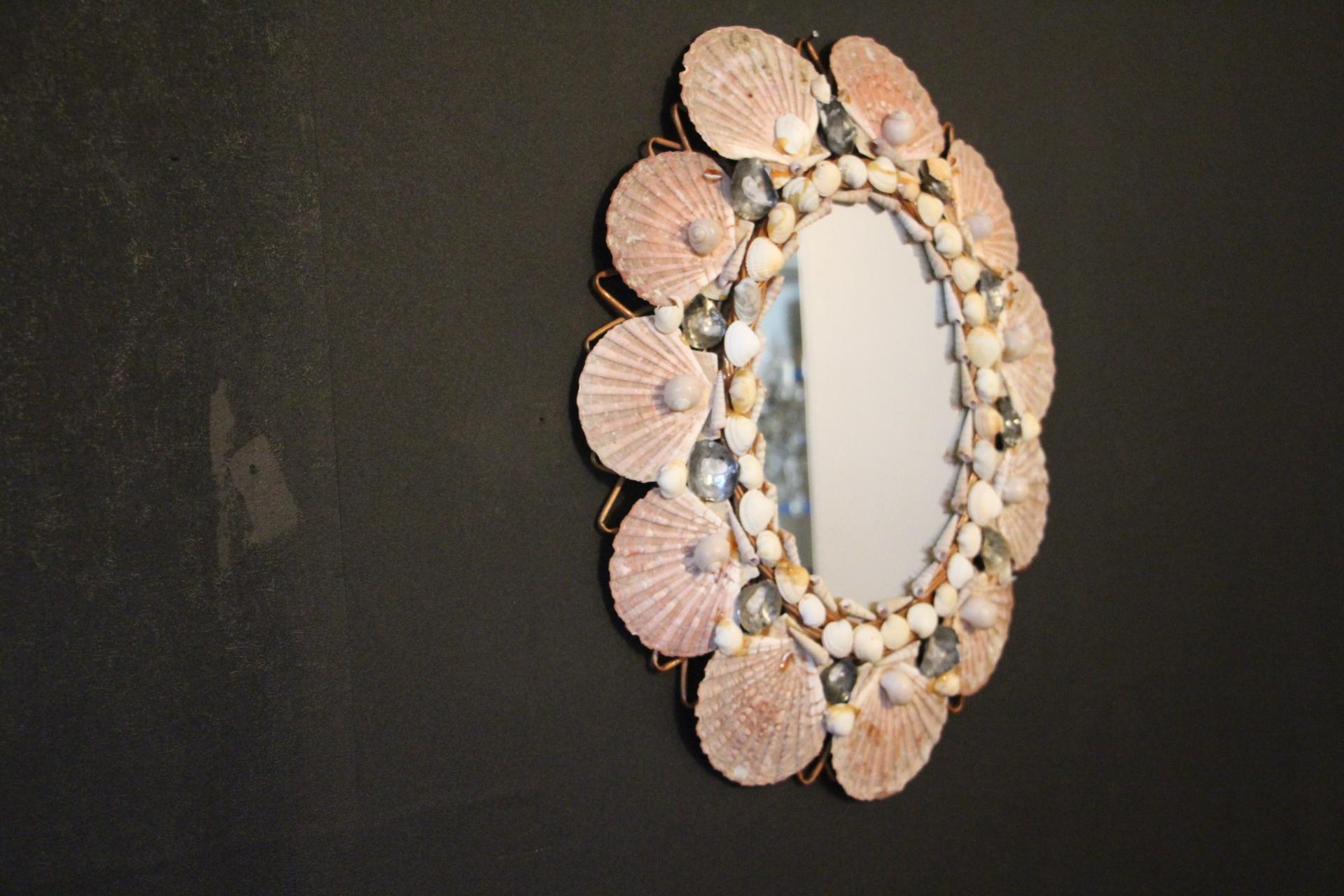 This very decorative mirror was made in Italy in 1960’s. It is typical of this period design and is all original. It was handcrafted and is in perfect condition. It has got a beautiful shape and looks like a summer souvenir....There are a lot of
