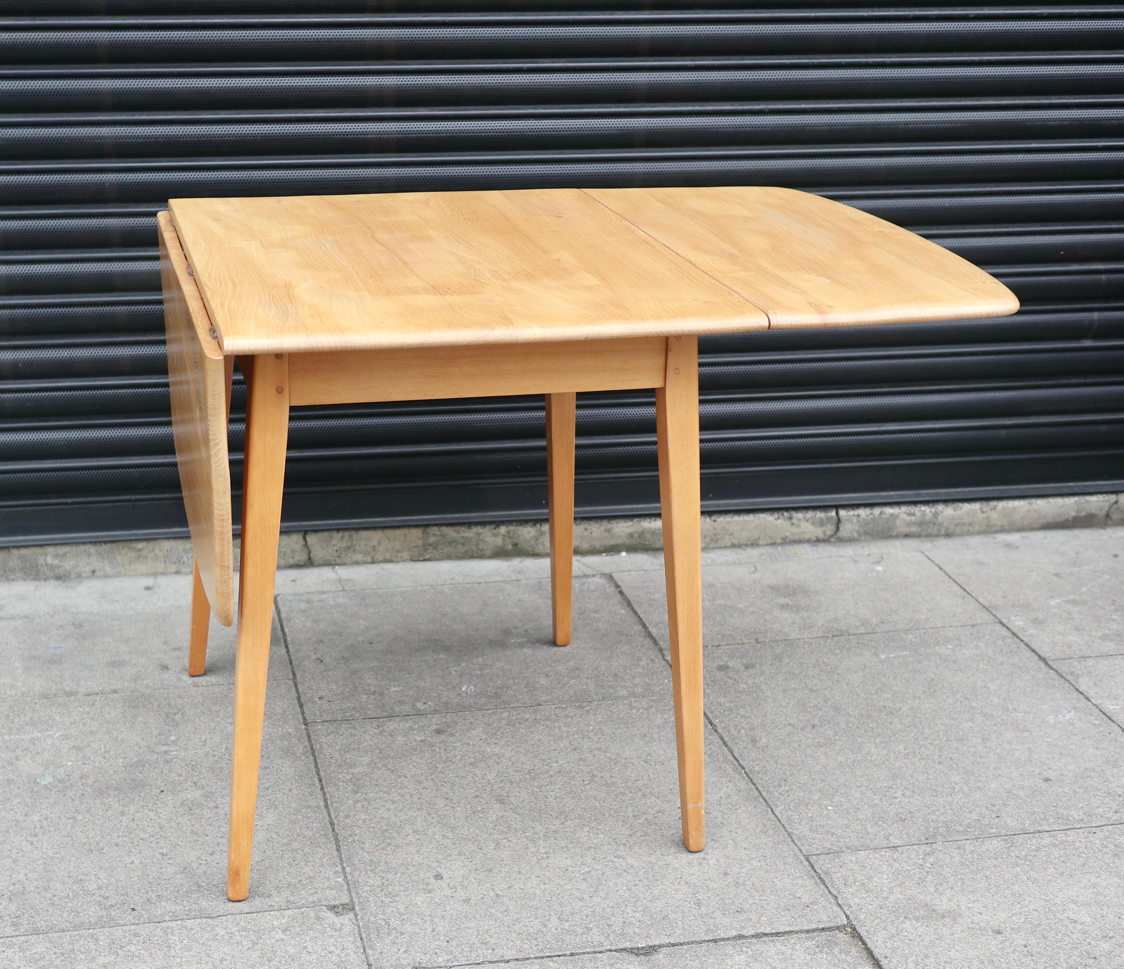 English Vintage 1960s rectangle  Ercol drop leaf Elmwood and Beech dining table For Sale