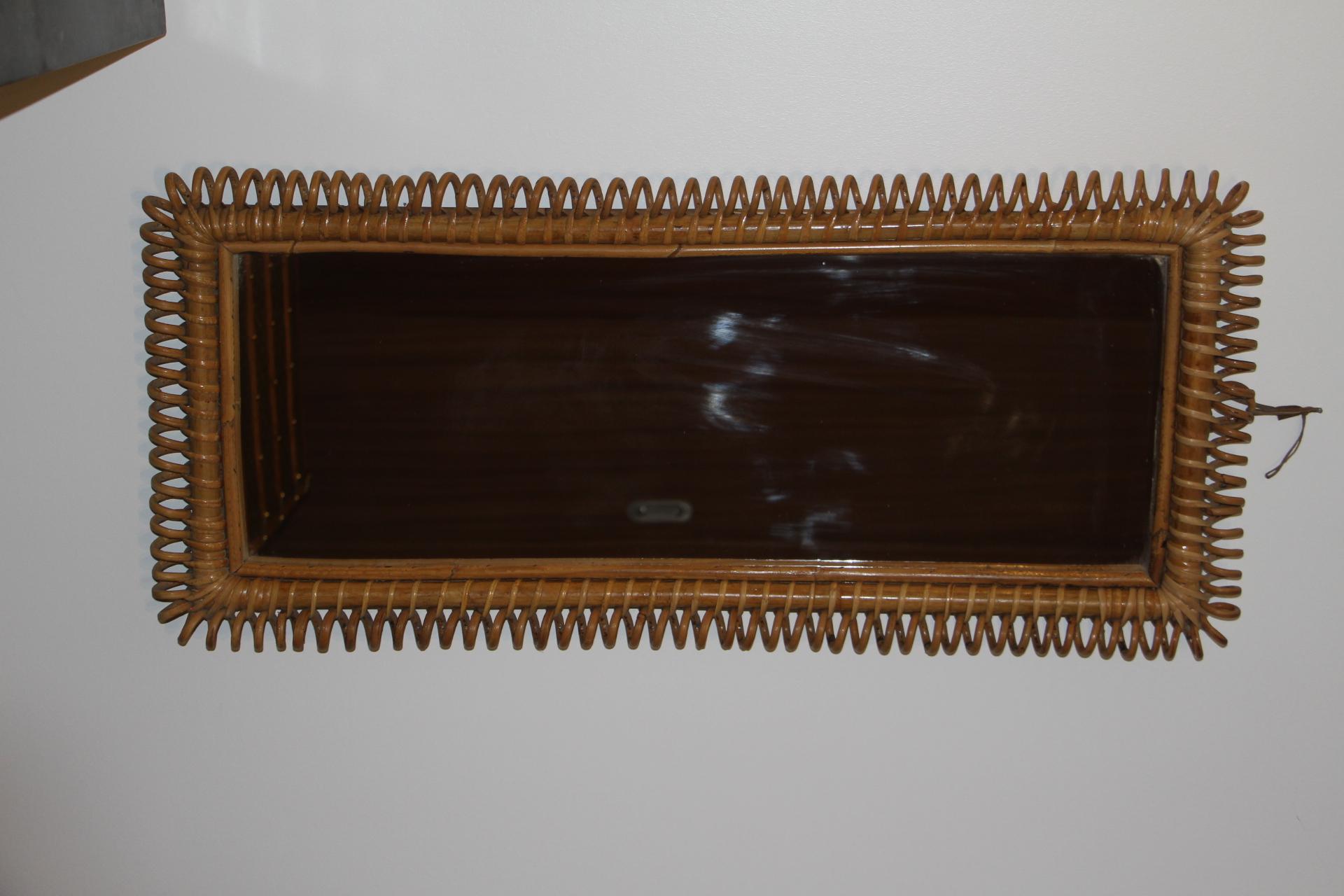 This very decorative mirror was made in Italy in 1960’s .It is typical of this period design and is all original.It was handcrafted and is in perfect condition. It has got a beautiful and very unusual rectangular shape, full of charm.
It could be