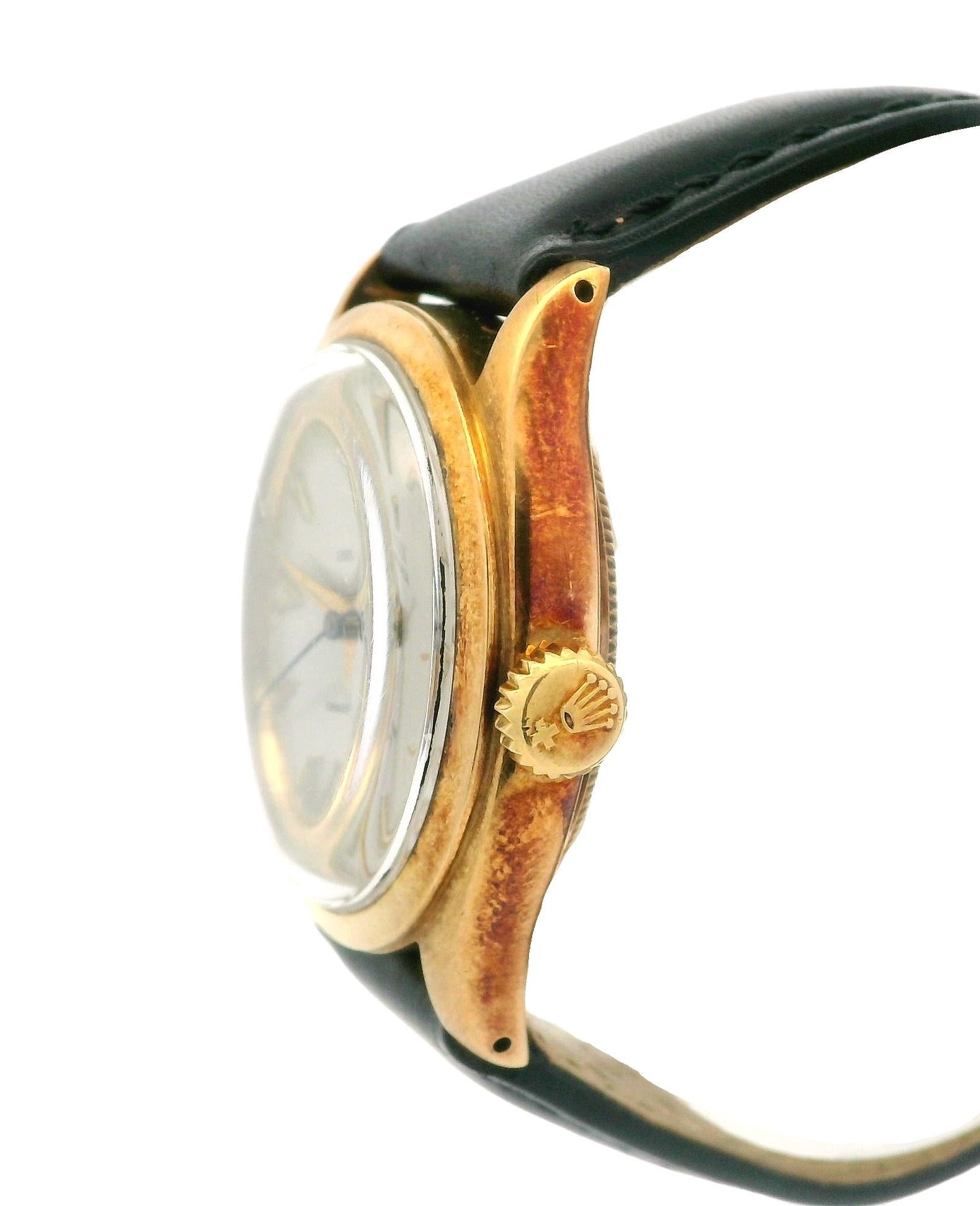 
Watchmaker:	Rolex
Movement:	Swiss Made - Automatic - Self Winding
Case Material:	14k Yellow Gold
Weight:	50.1 Grams
Case Size (Diameter):	34mm (not including the crown)
Height:	39mm (lug to lug)
Strap:	Genuine Black Leather w/ Gold Tone Buckle and
