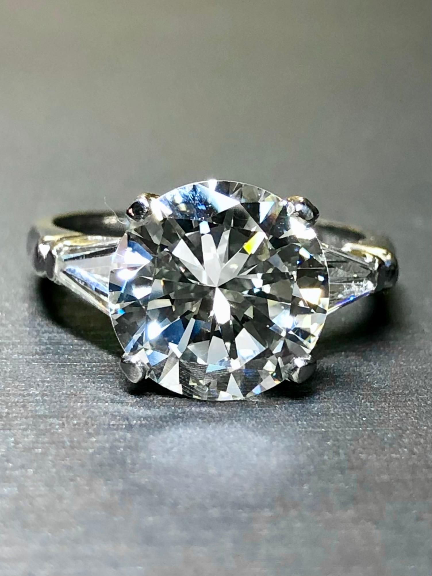 
A classic engagement ring circa the early 1960’s done in platinum and centered by a 3.53ct round diamond being (I) in color and Si1 in clarity. The center stone is gorgeous and 1000% eye clean. If you look carefully at the plot on the GIA report,