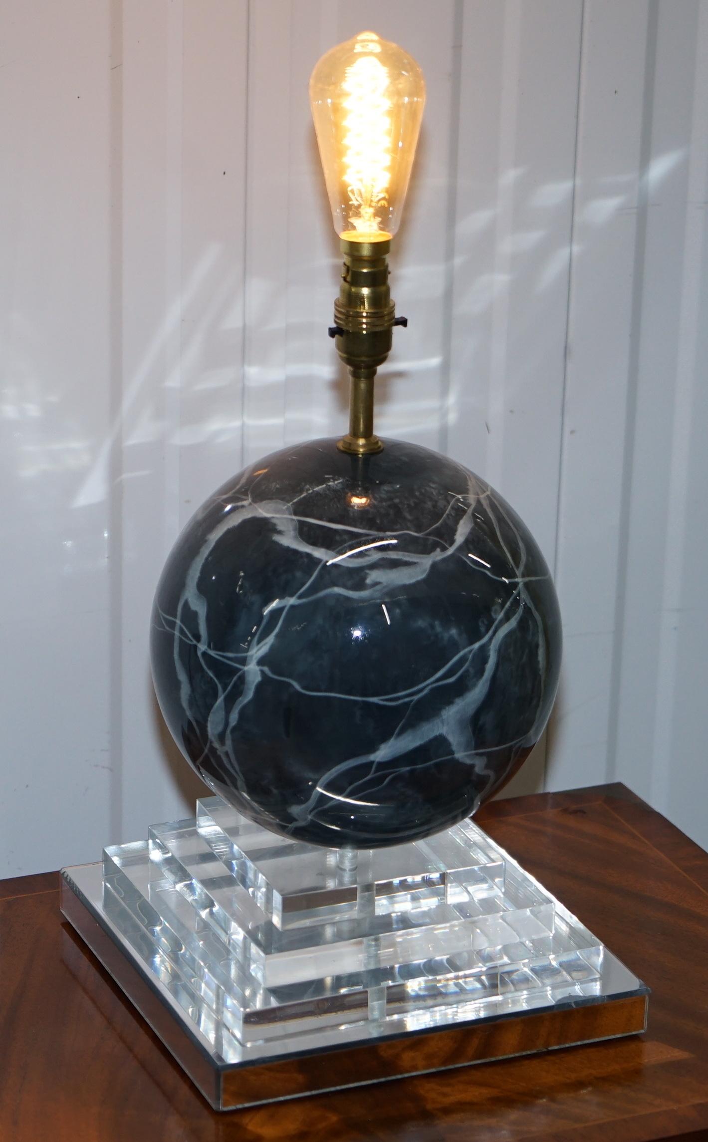 We are delighted to offer for sale this lovely vintage circa 1960s round marble finish lamp on a four step perspex base with mirrored finish

A very good looking rare and decorative table lamp, I've never seen another of this type, the round ball