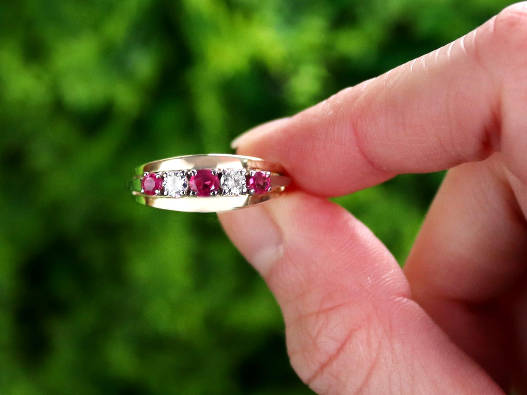 A fine and impressive antique 0.65 carat diamond and 0.28 carat natural ruby, 14 karat yellow gold and 14 karat white gold set five stone/cocktail ring; part of our diverse gemstone ring collection.

This fine and impressive vintage ruby and diamond