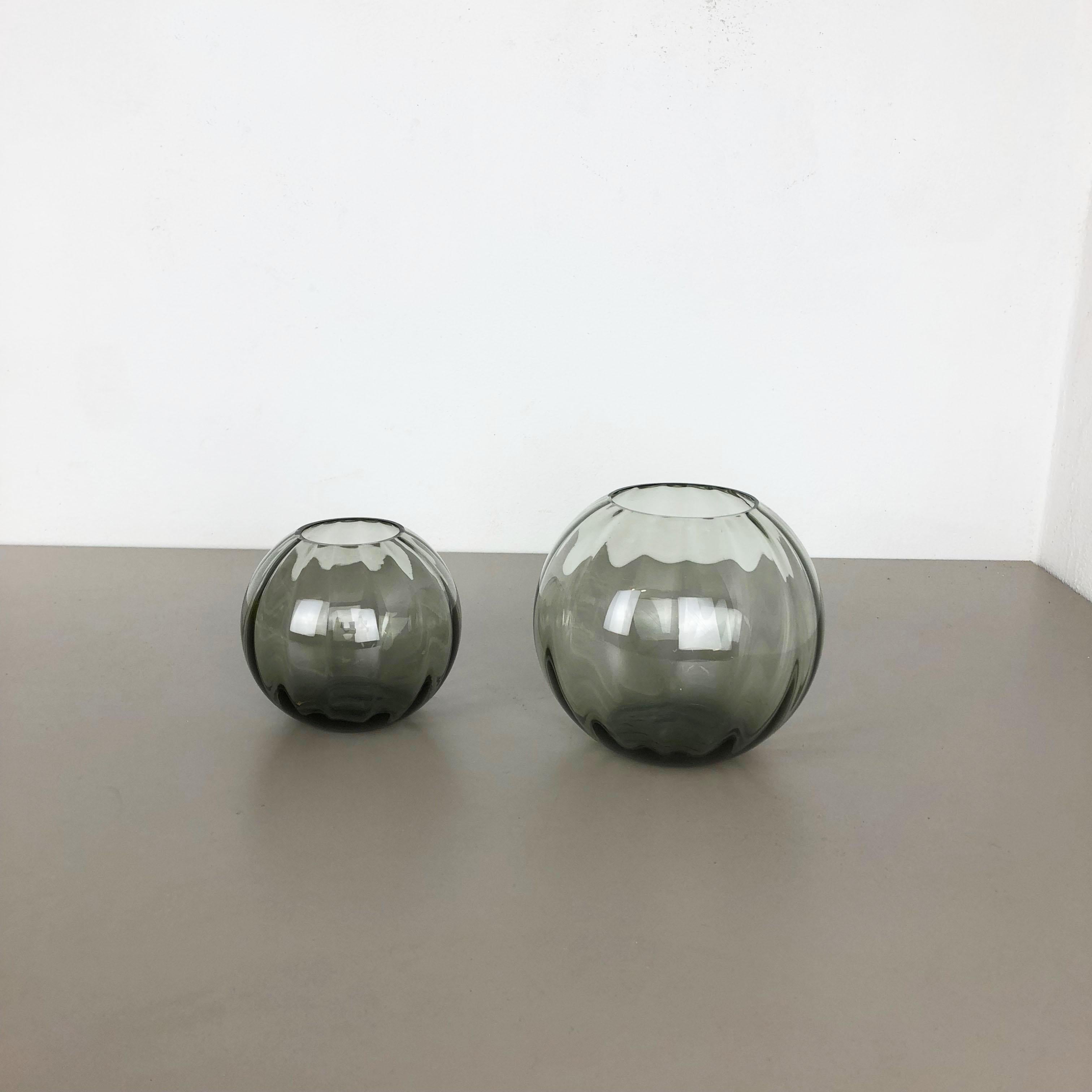 Article:

Set of two Turmalin vases


Producer:

WMF, Germany


Design:

Prof. Wilhelm Wagenfeld BAUHAUS



Decade:

1960s


Original vintage 1960s set of 2 Vases of the Wagenfeld Turmalin series. These two vase are designed by