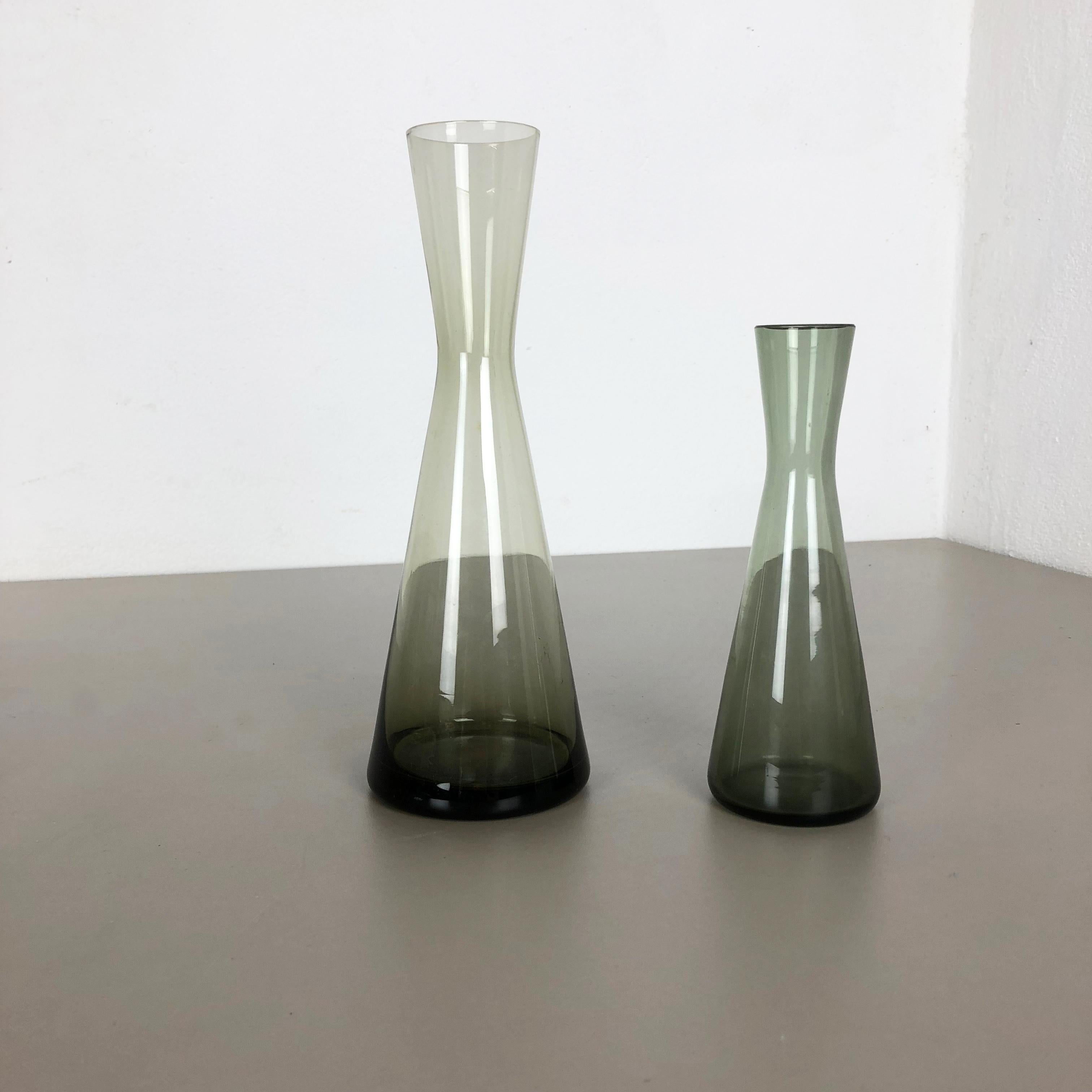 Article:

Set of 2 Turmalin vases


Producer:

WMF, Germany


Design:

Prof. Wilhelm Wagenfeld Bauhaus 



Decade:

1960s


Description:

Original vintage 1960s Set of 2 Vases of the Wagenfeld Turmalin series. These two vase