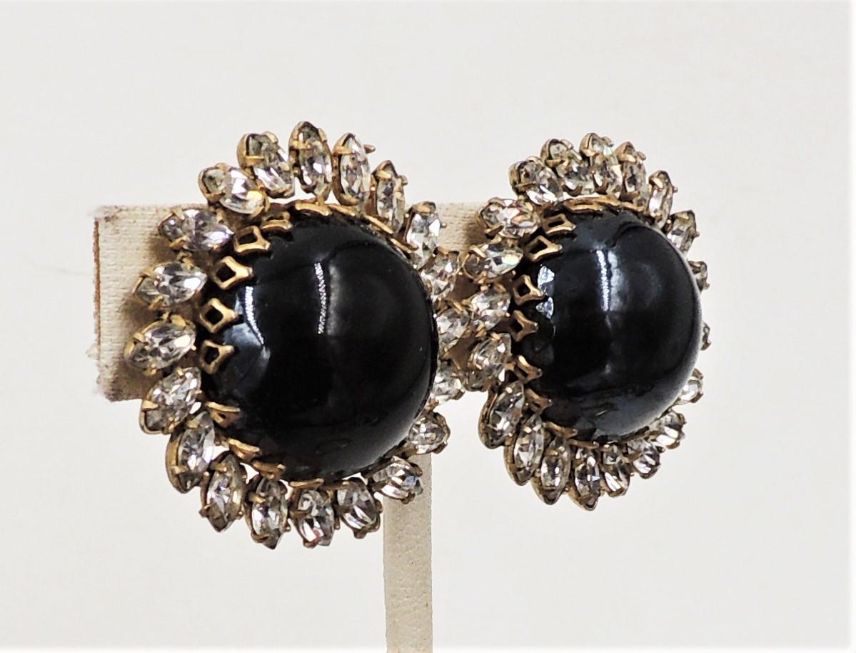 1960s goldtone cabochon faux-onyx and marquise clear rhinestone clip back earrings. Marked 