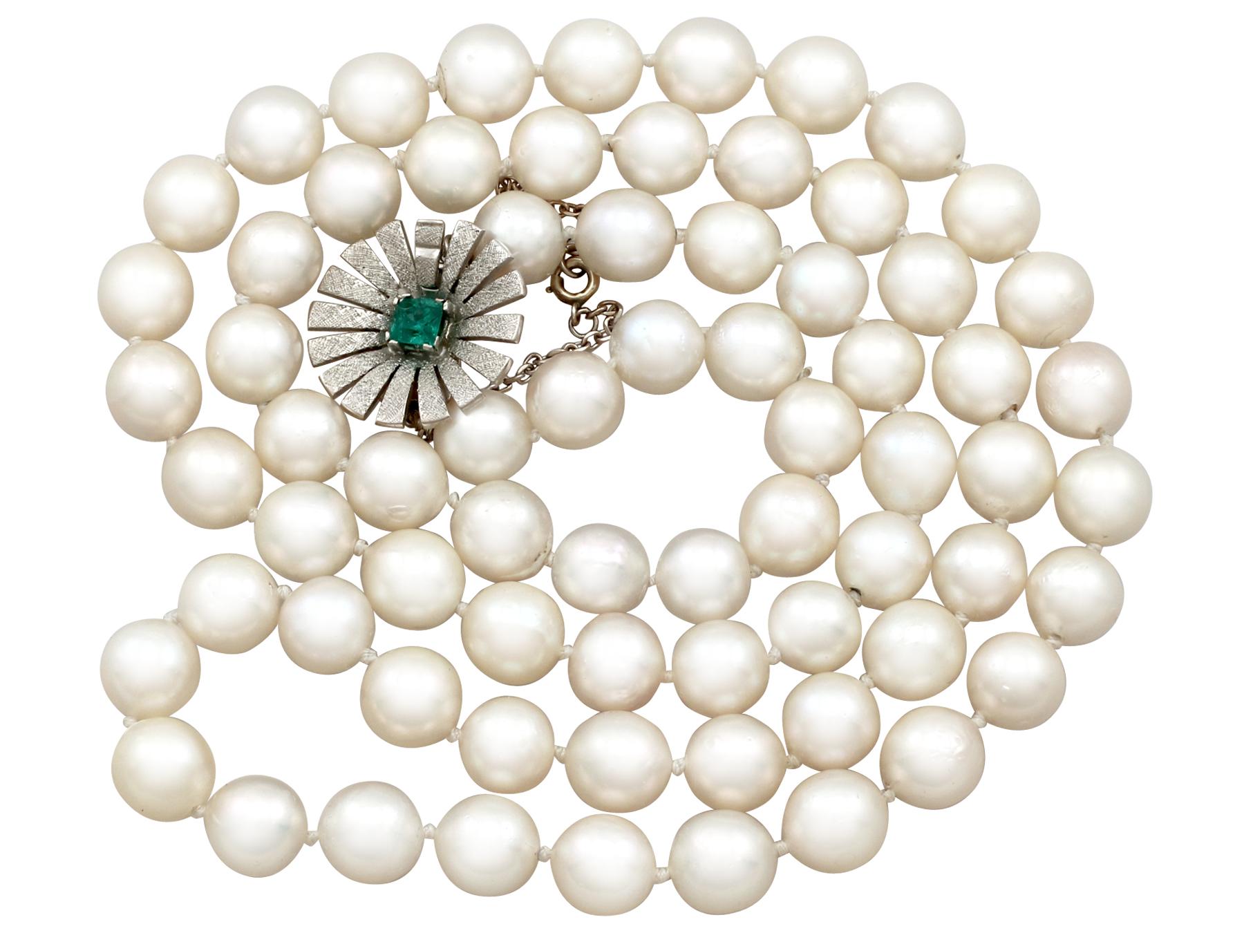 A fine and impressive vintage single strand cultured pearl necklace with a 0.48 carat emerald and 18 karat white gold clasp; part of our diverse jewelry collections.

A video of this fine pearl necklace is available upon request.

This impressive